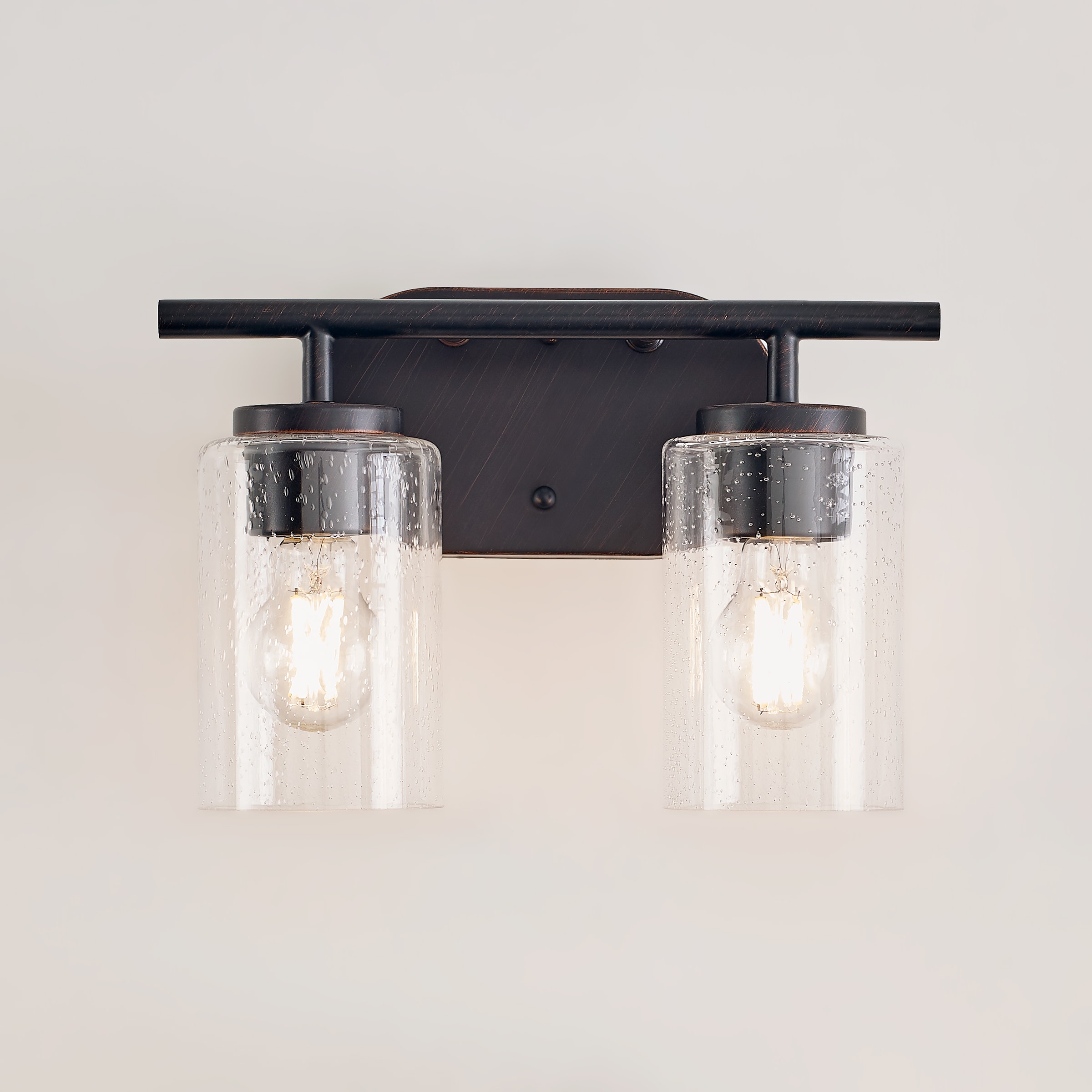 Oslo Bronze 2-Light Vanity Fixture with Clear Seeded Glass