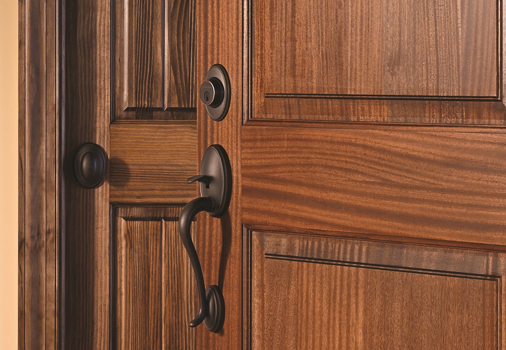 The Milford Passage Set in Bronze Finish with Oval Door Knobs