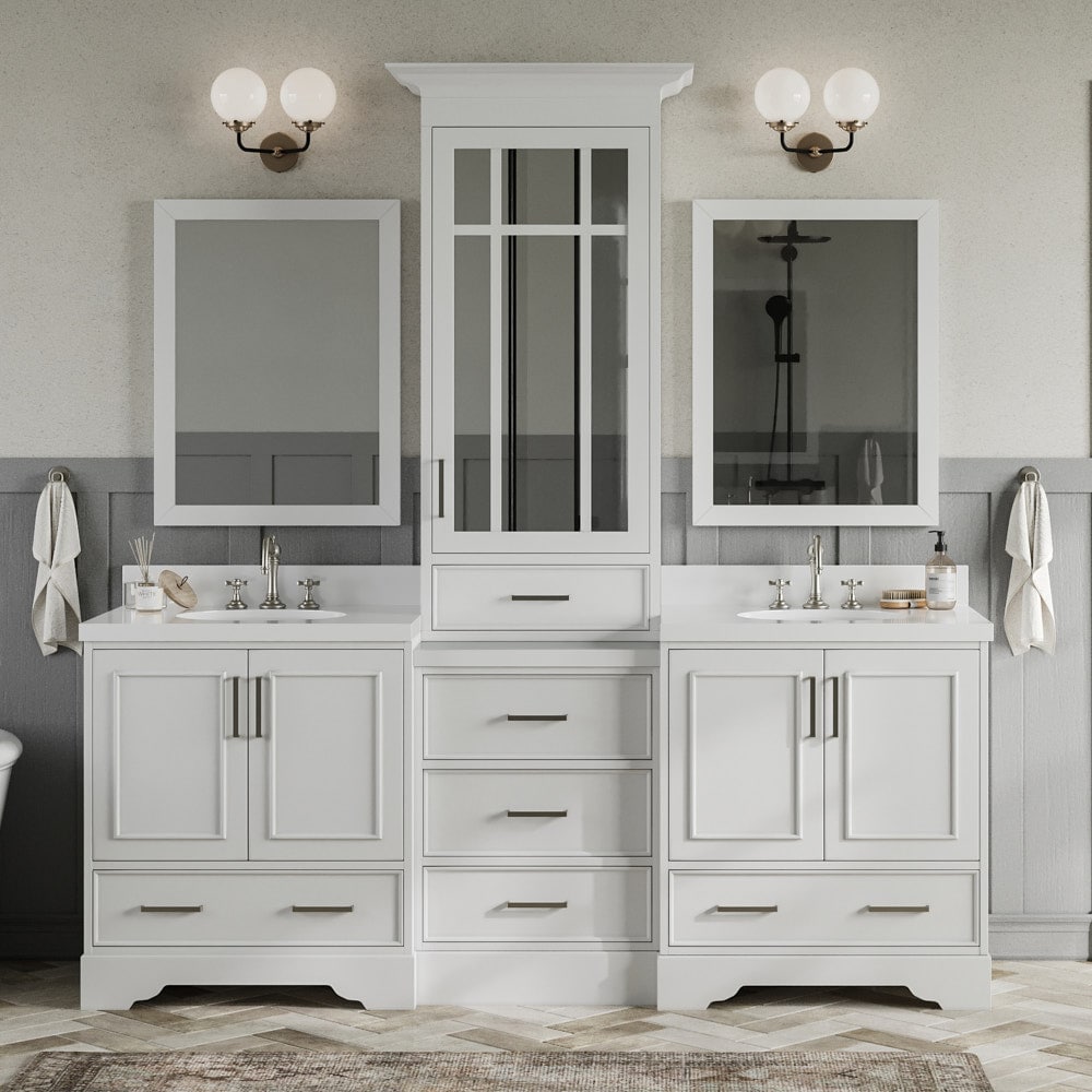 J & D Kitchen Distributors, Inc. - These vanities are separated by an extra  deep tall linen cabinet with tons of extra storage! And I just love the  tile backsplash all the