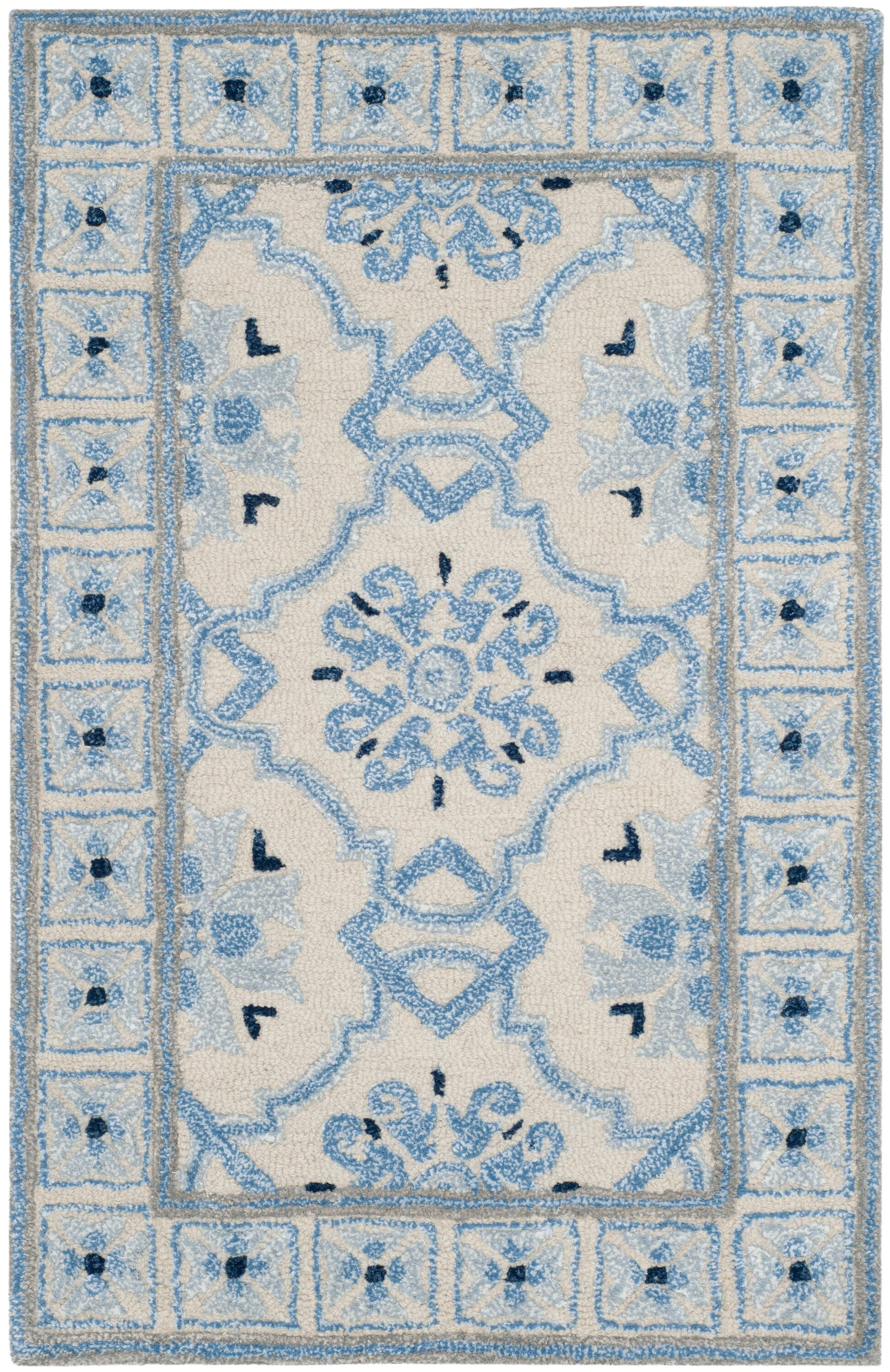 Handmade Ivory and Blue Wool Viscose Tufted Area Rug