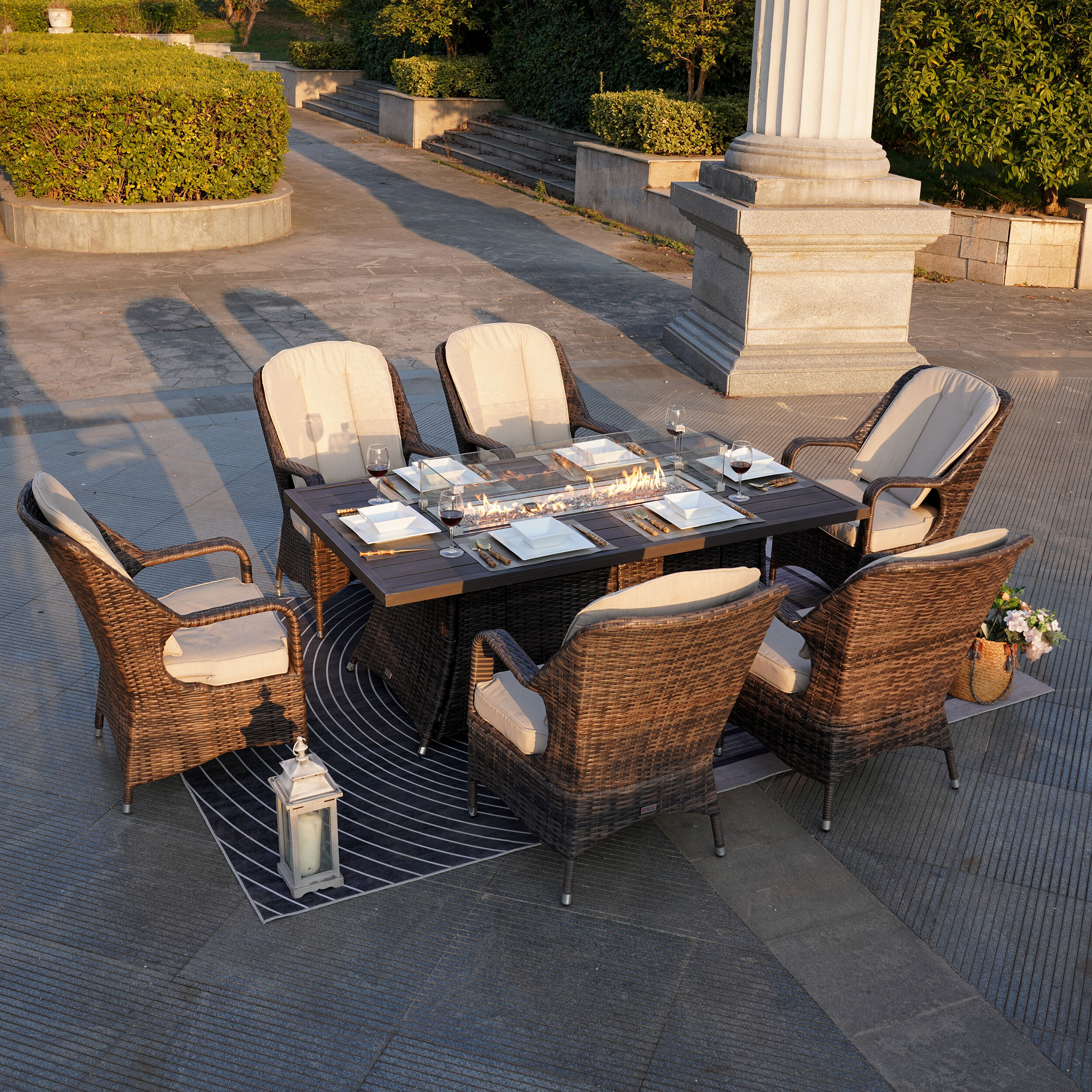 Moda Furnishings 1106RA-009-B 1106RA-009-BR 7 -Piece Brown Wicker Patio Dining Set Wicker Rectangle Table with 6 Tan Cushions Stationary Chairs Fire Pit Included