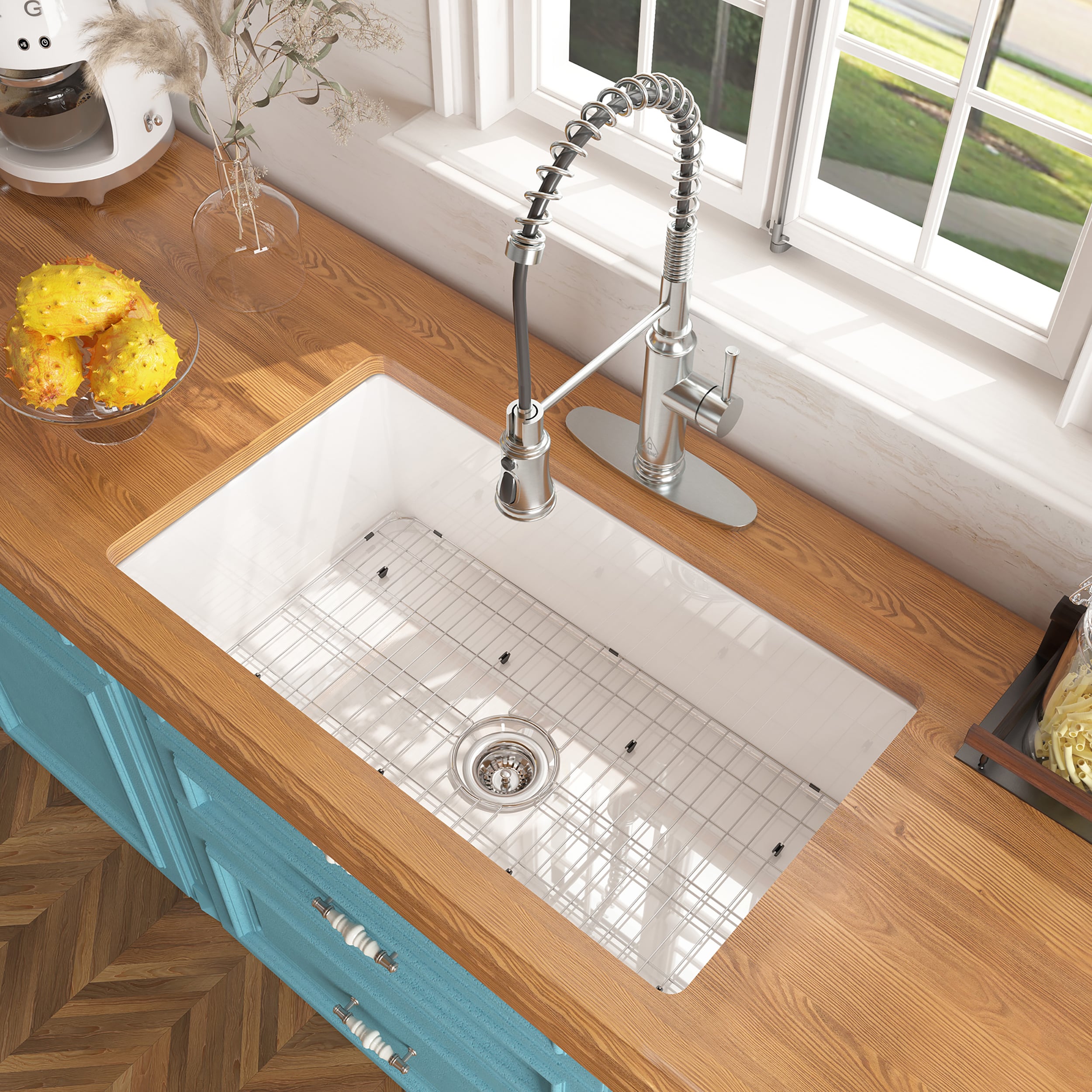 Utensils And Ornaments On Shelf Above Kitchen Sink With Golden Tap