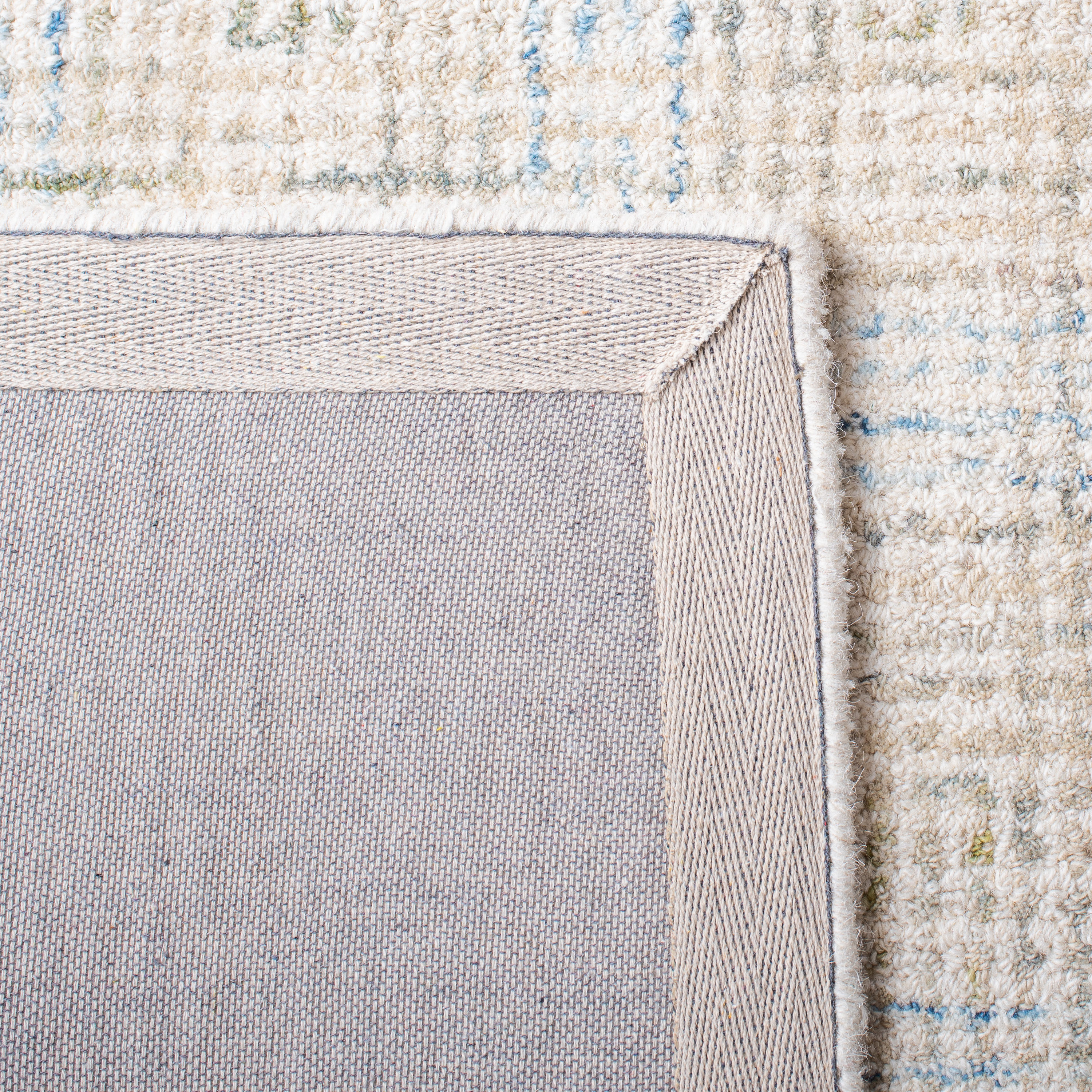 Ivory and Beige Handmade Wool Abstract Area Rug 5' x 8'