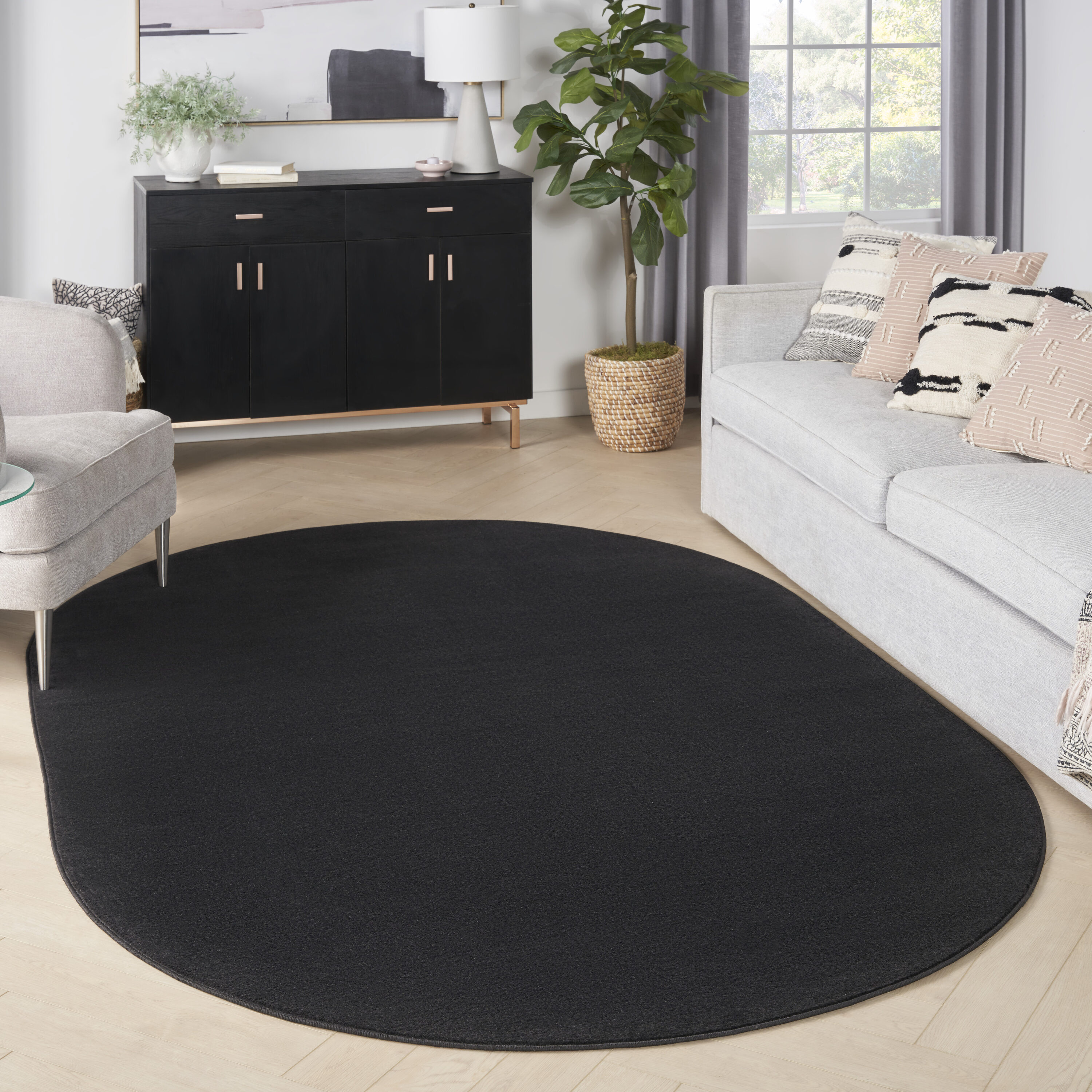 Nourison 099446062079  Essentials 6 x 9 (ft) Loomed Polypropylene Black Oval Indoor/Outdoor Solid Area rug