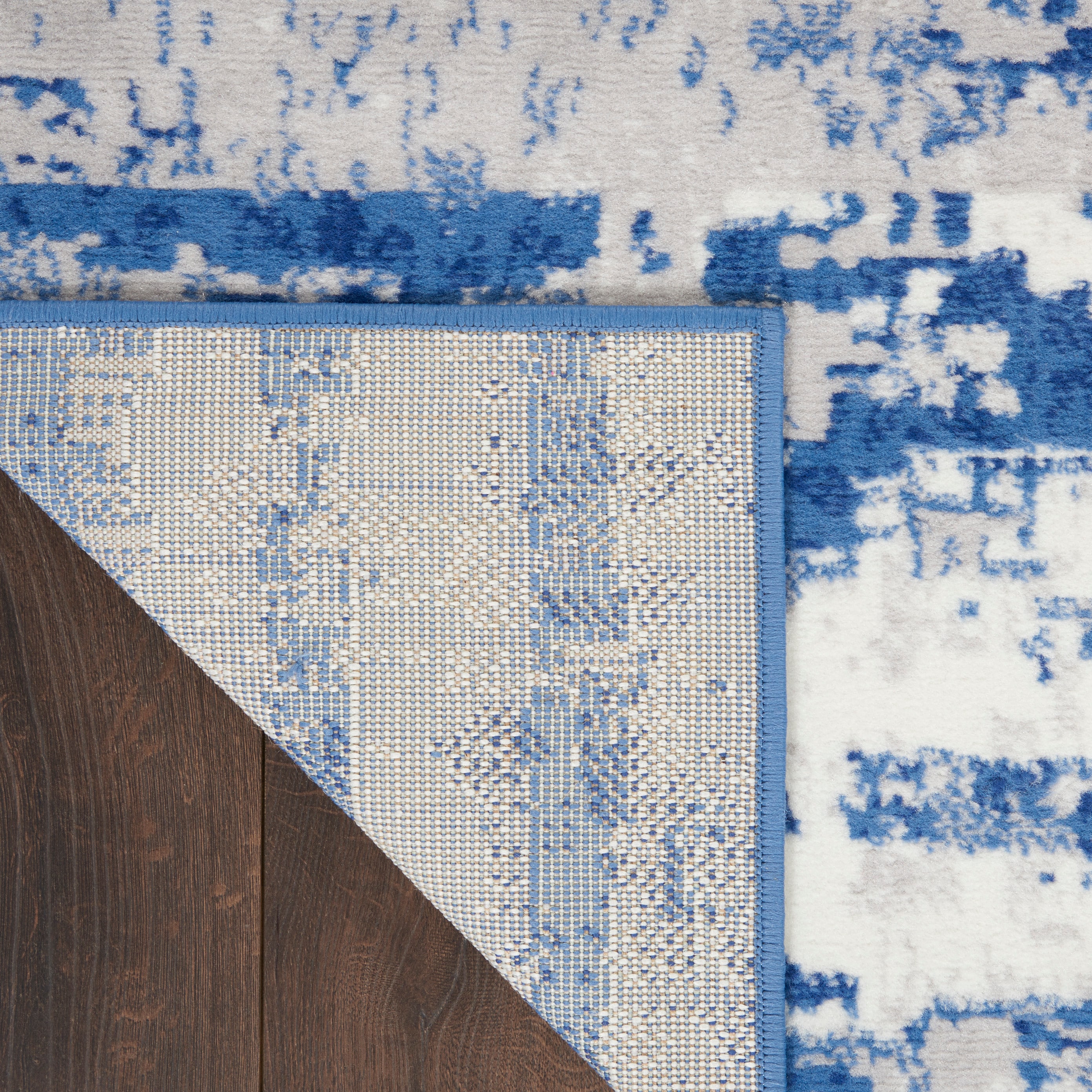 Ivory and Navy Abstract Synthetic Runner Rug