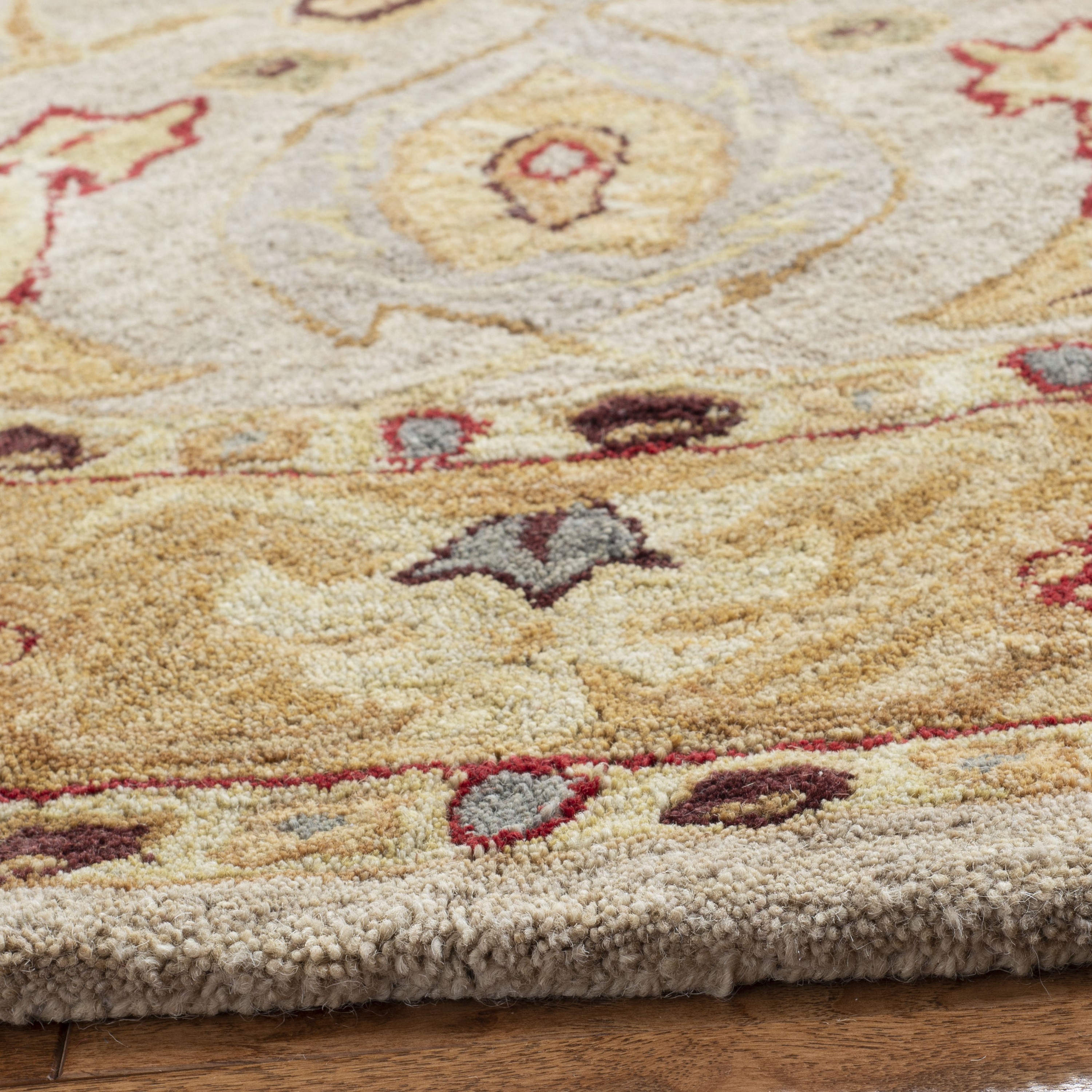 Handmade Ivory and Gold Round Wool Area Rug