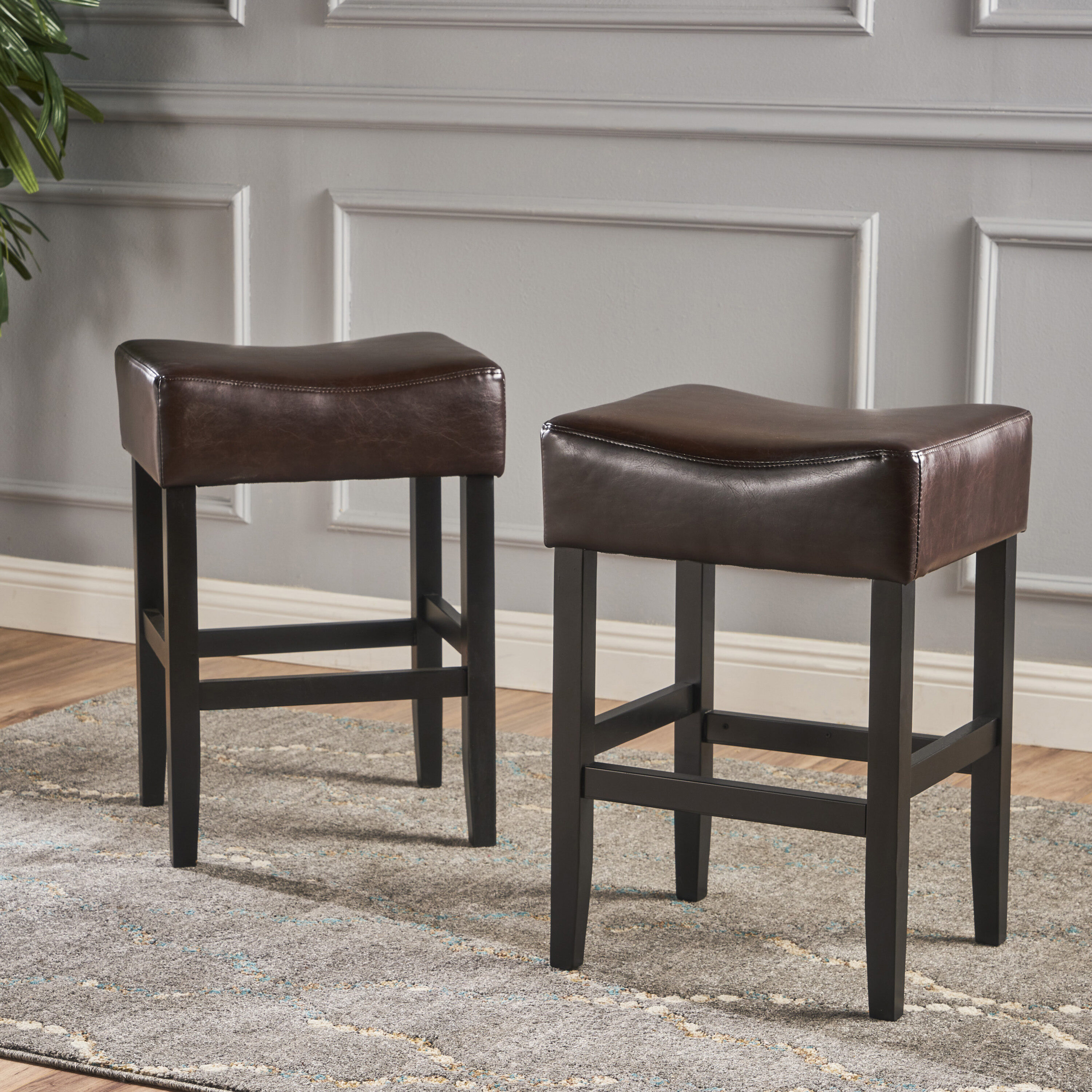 Brown Leather and Wood Backless Saddle Counter Stools, Set of 2