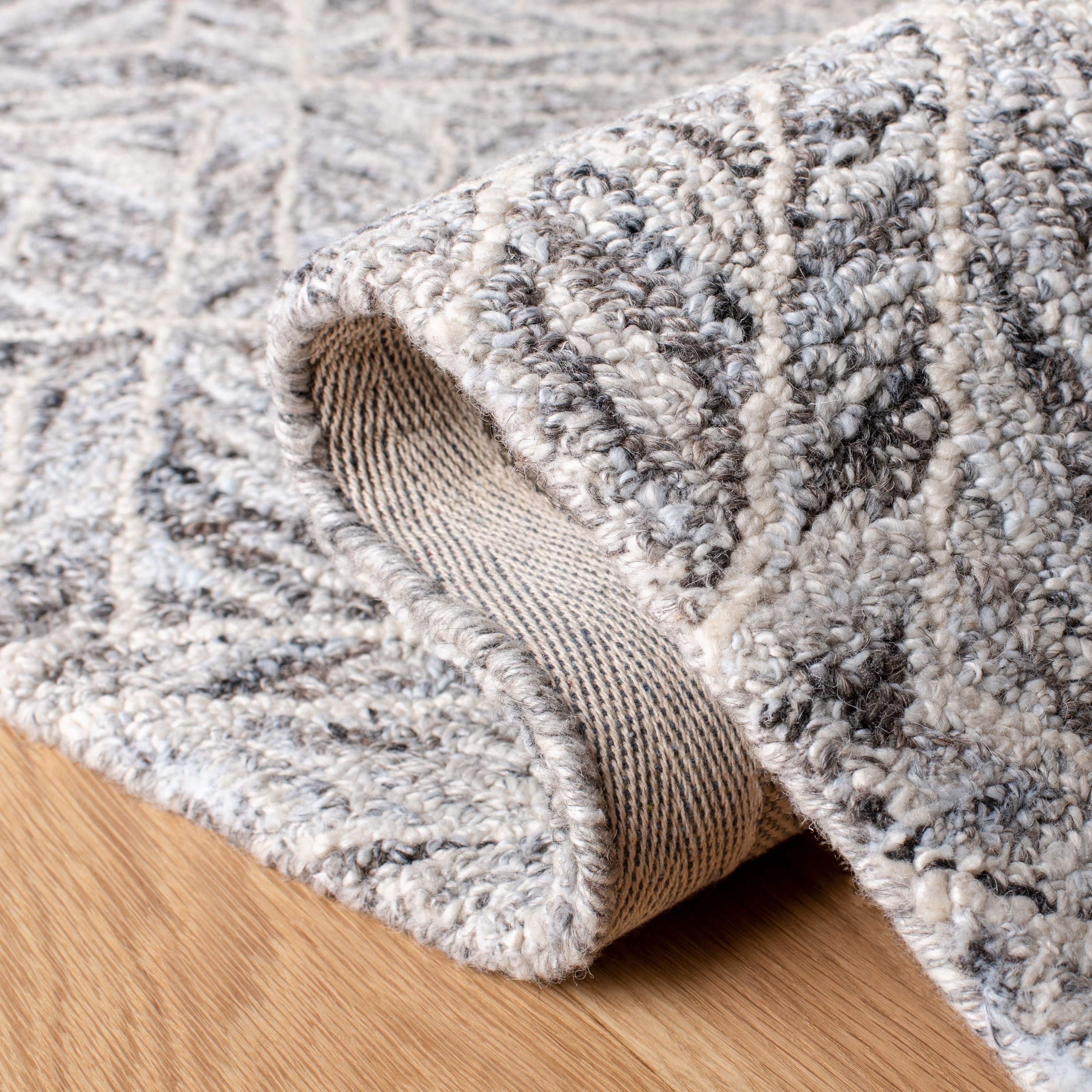 Handmade Abstract Gray and Beige Tufted Wool Rug - 27" x 7"