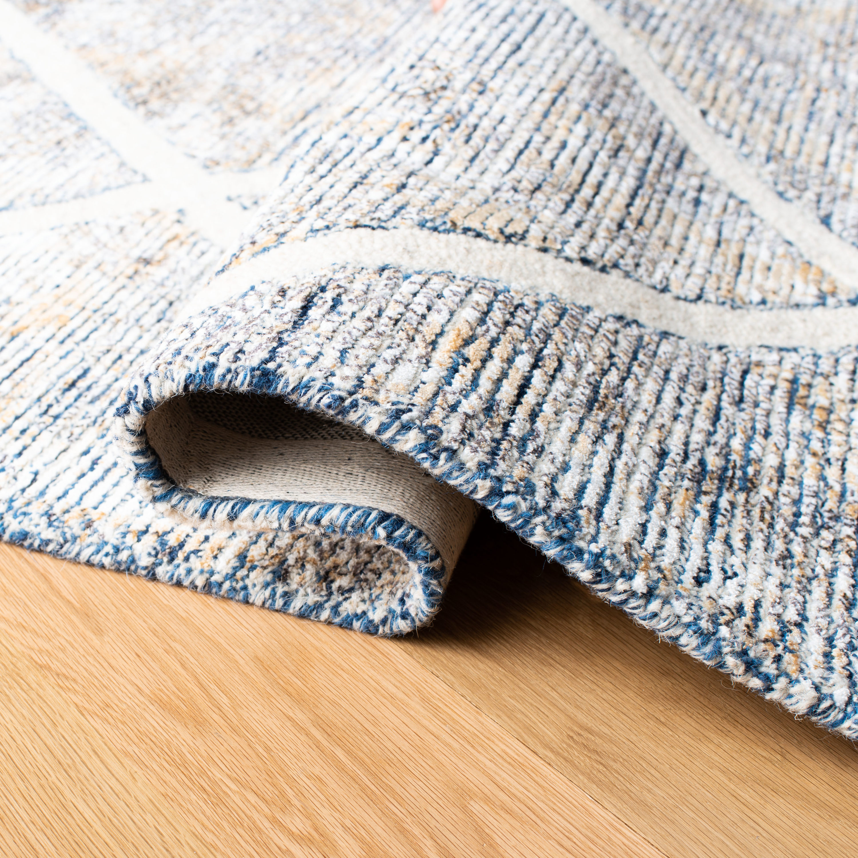 Ivory and Gold Hand-Tufted Wool and Viscose 5' x 8' Area Rug