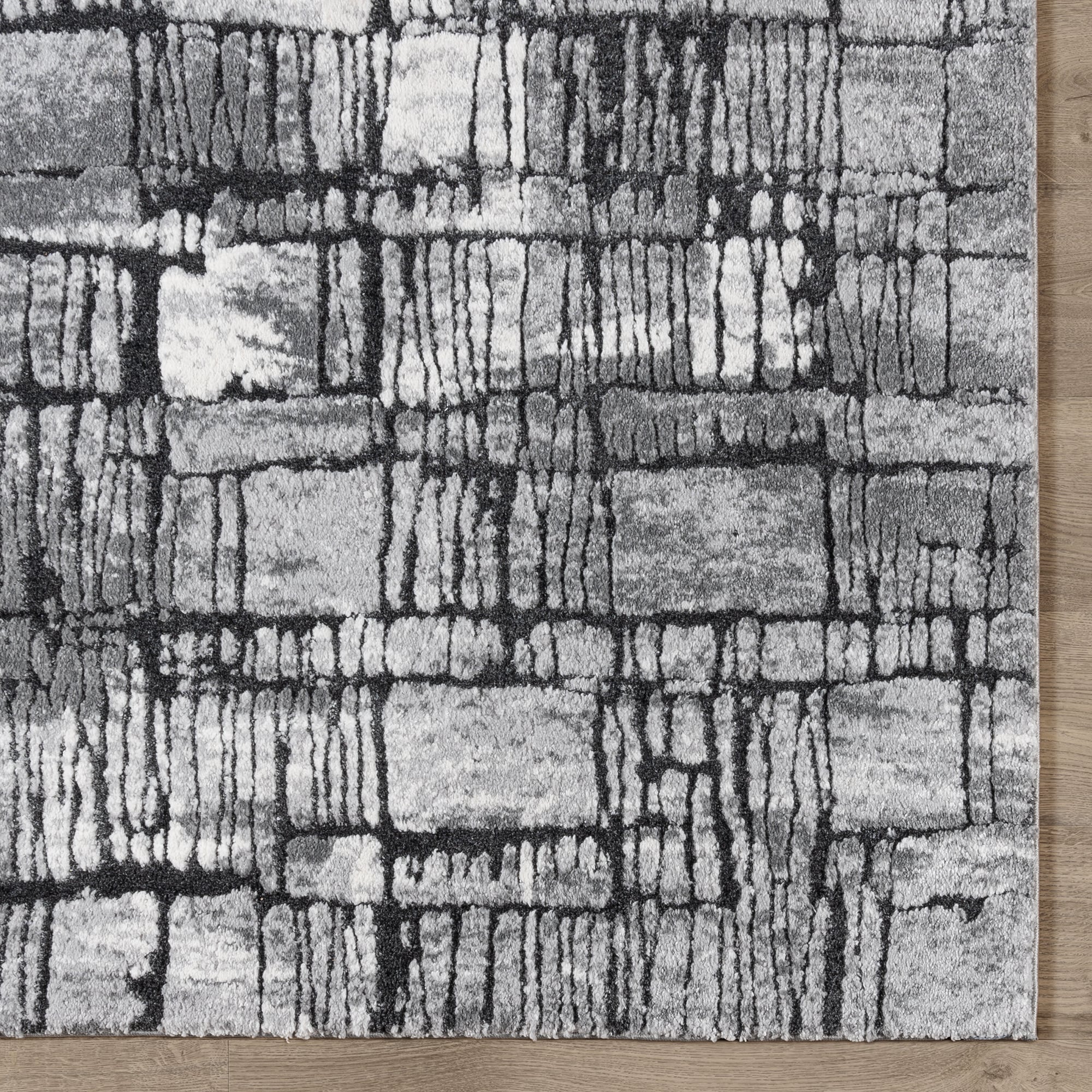 Imani 6' x 9' Black and Gray Abstract Shag Rug