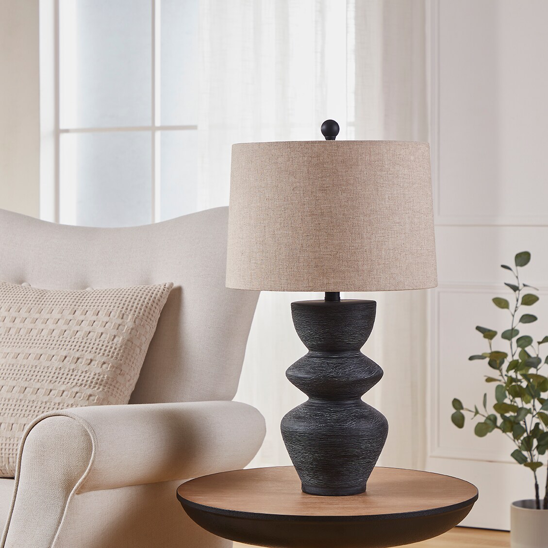 Kawoti 25" Black Distressed Ceramic Table Lamp with Beige Shade