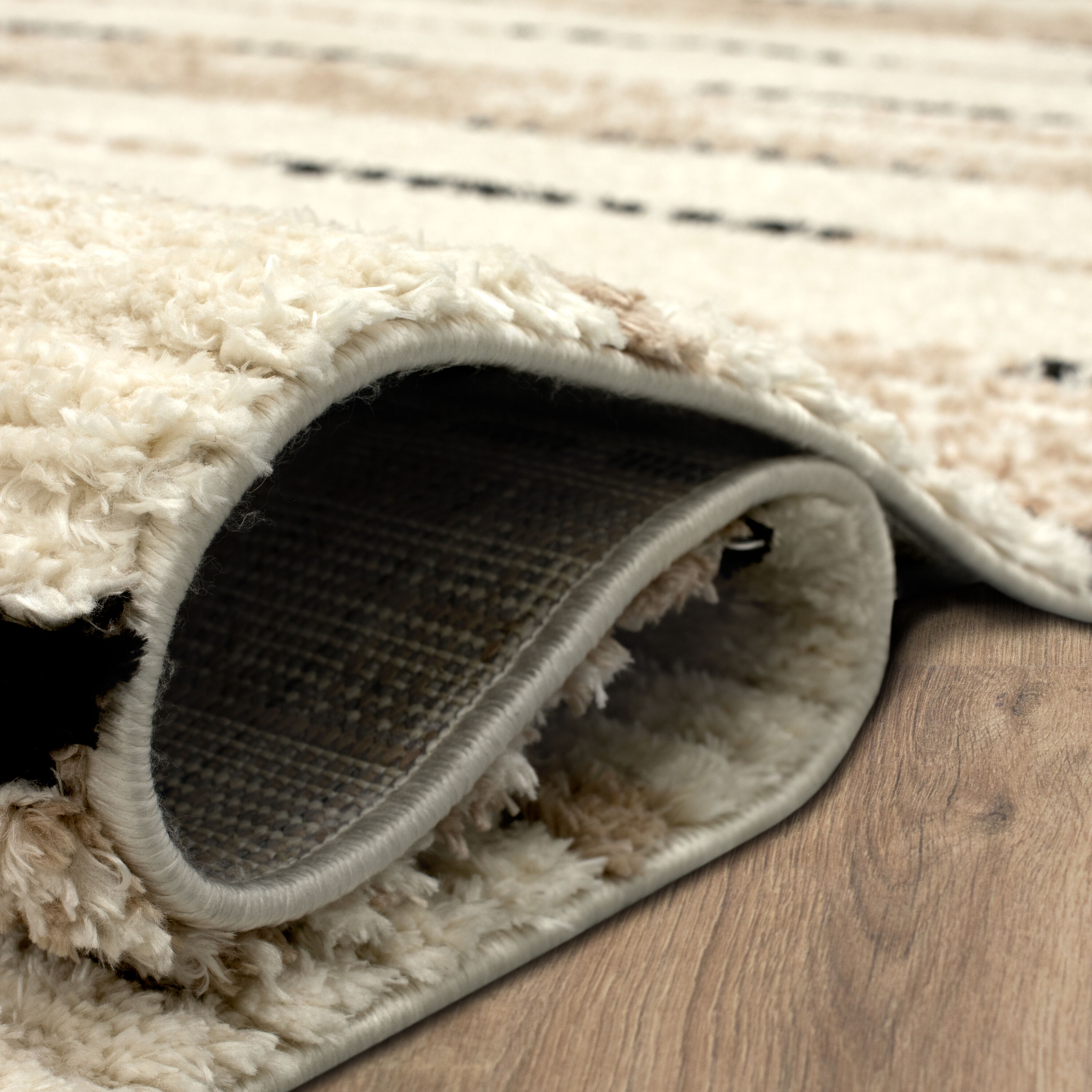 Traverse Lanes Tan and Black Striped Synthetic Area Rug