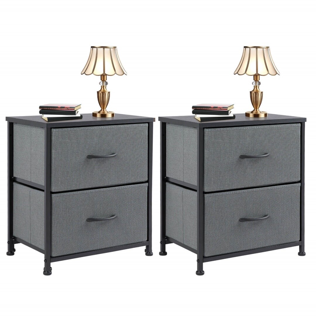 Two gray fabric drawer nightstands with black metal frames, topped with lamps