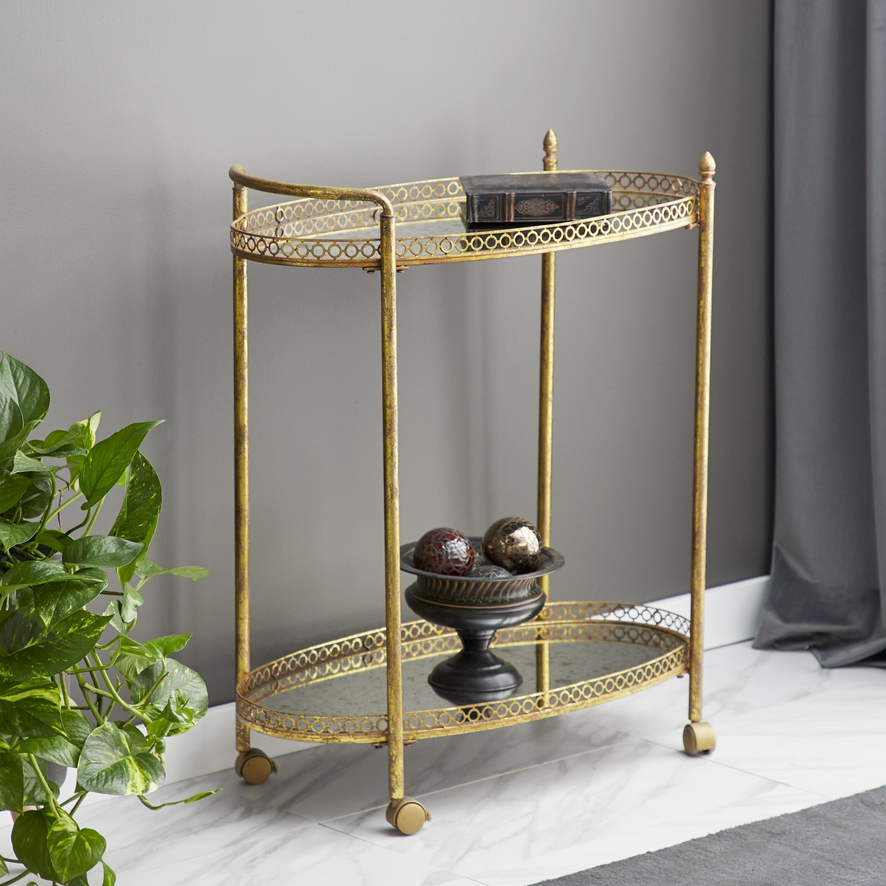Grayson Lane 93749 30.13-in x 34.63-in Gold Oval Bar cart