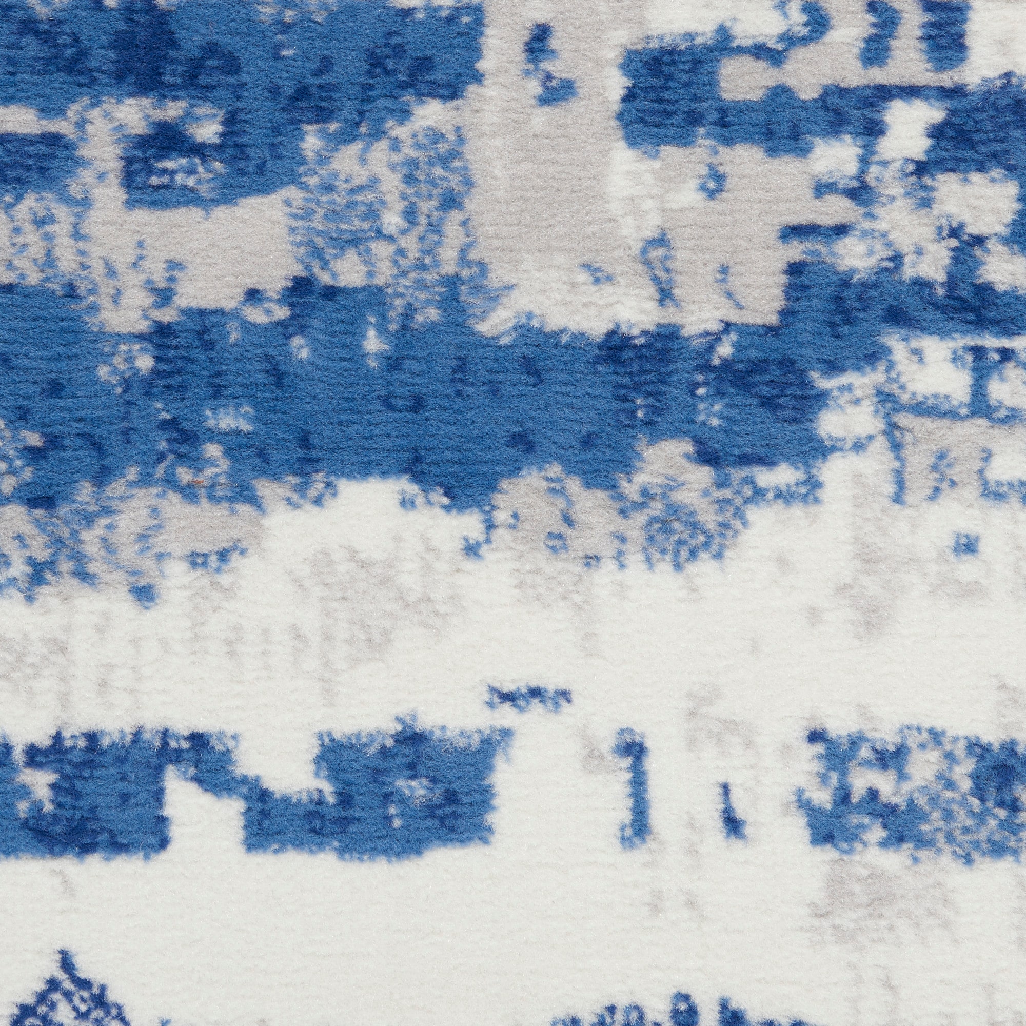 Ivory and Navy Abstract Synthetic Runner Rug