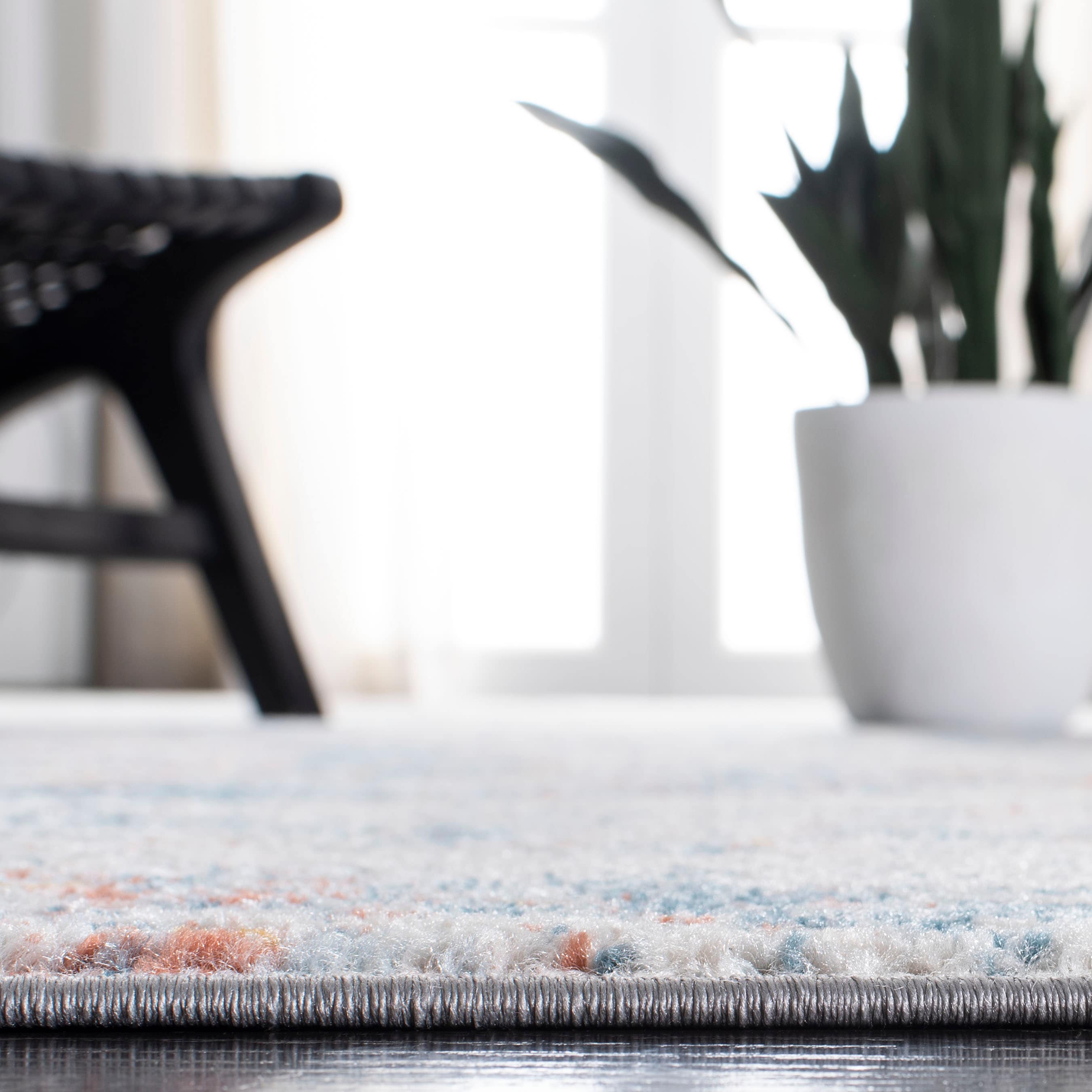 Ivory and Blue Abstract 9' x 12' Stain-Resistant Rug