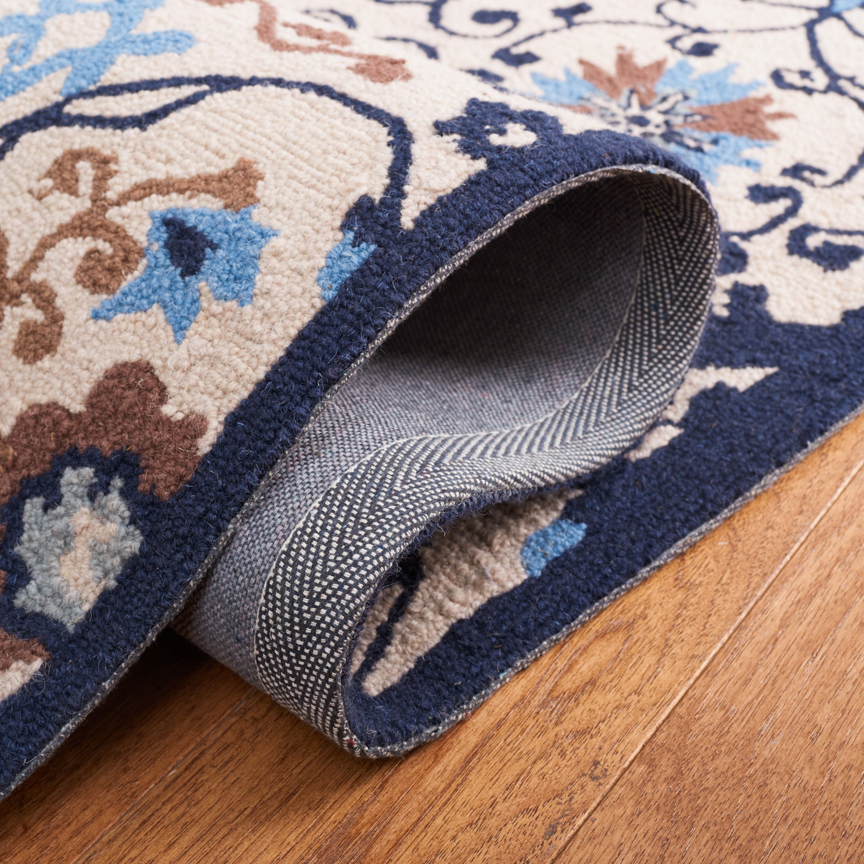 Handmade Ivory and Navy Floral Wool Rectangular Rug 4' x 6'