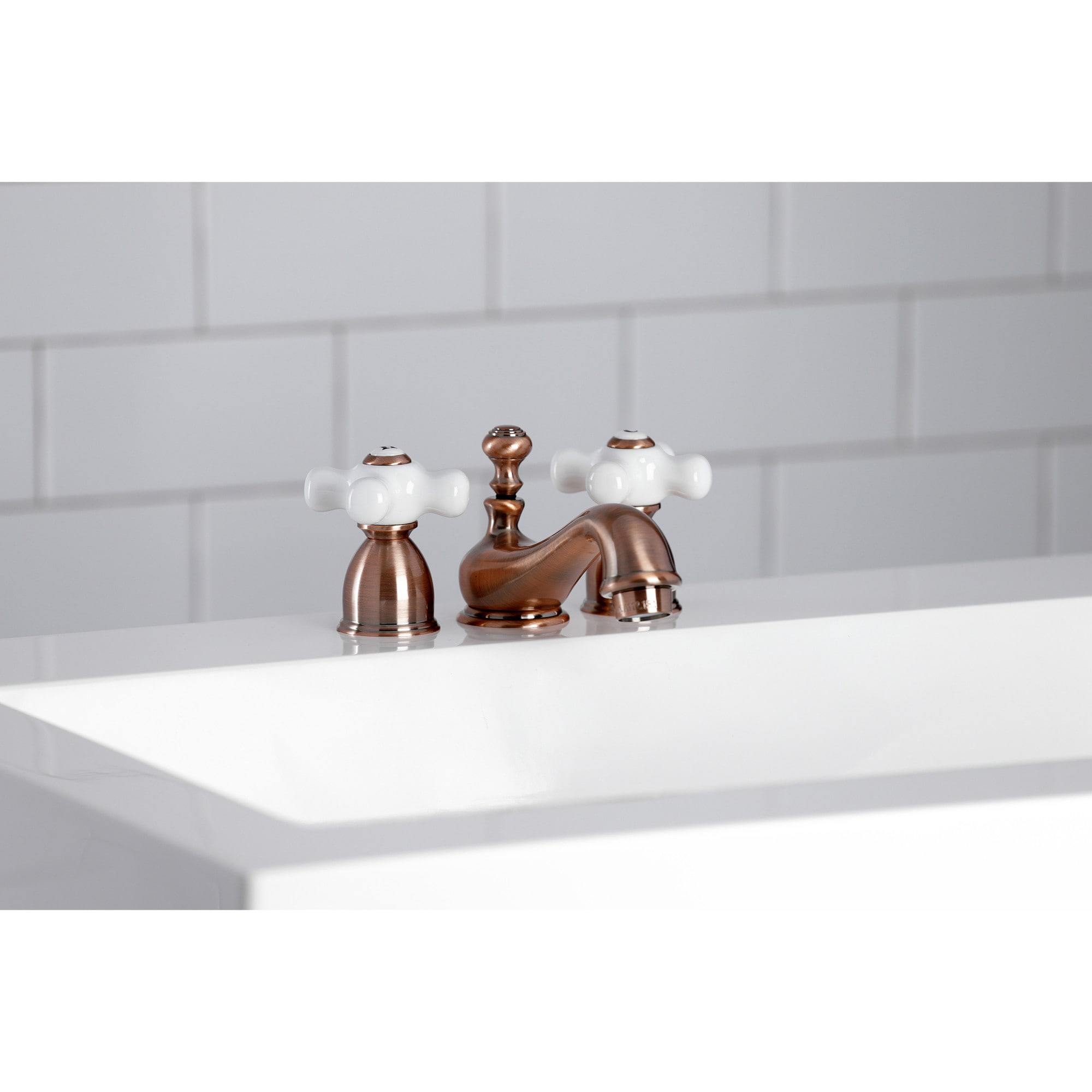 Kingston Brass WLKS395PXAC Restoration Antique copper Widespread 2-handle Low-arc Residential Handle Bathroom Sink Faucet with Drain