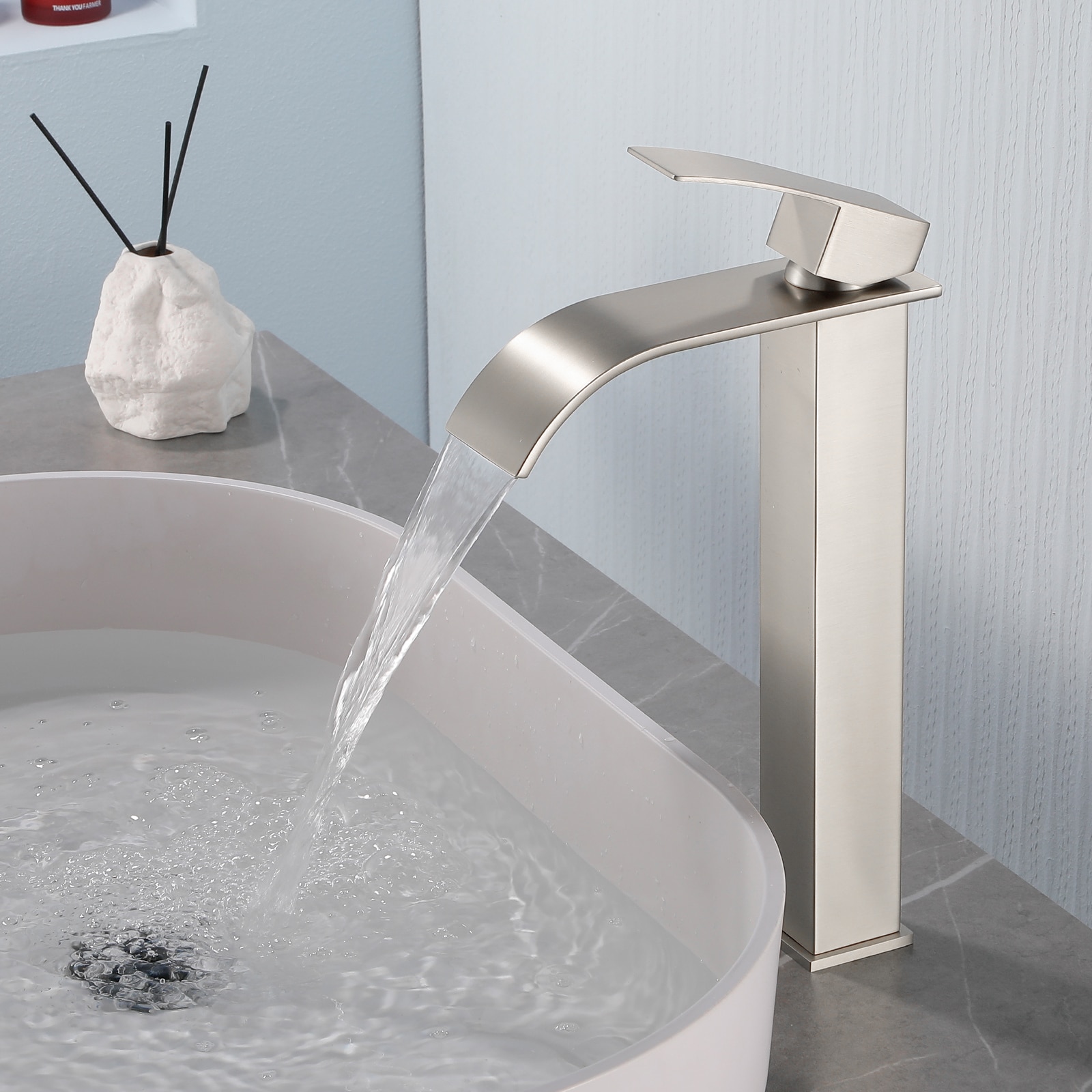 Dimakai - Single Handle Stainless Steel Faucet with Waterfall Flow and Pop Up Drain Brushed
