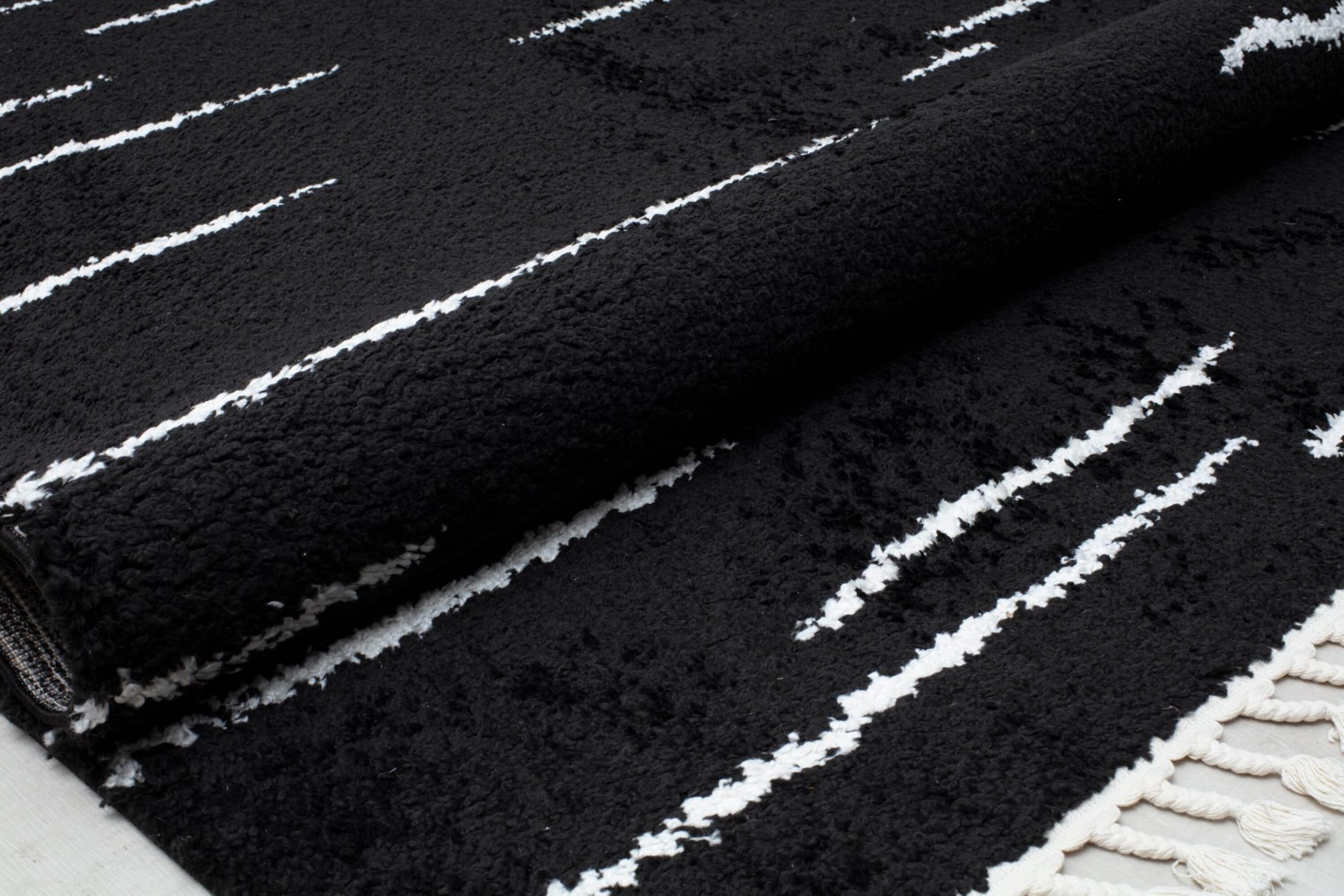 Introspective Black Abstract Shag Synthetic Area Rug with Braided Tassels