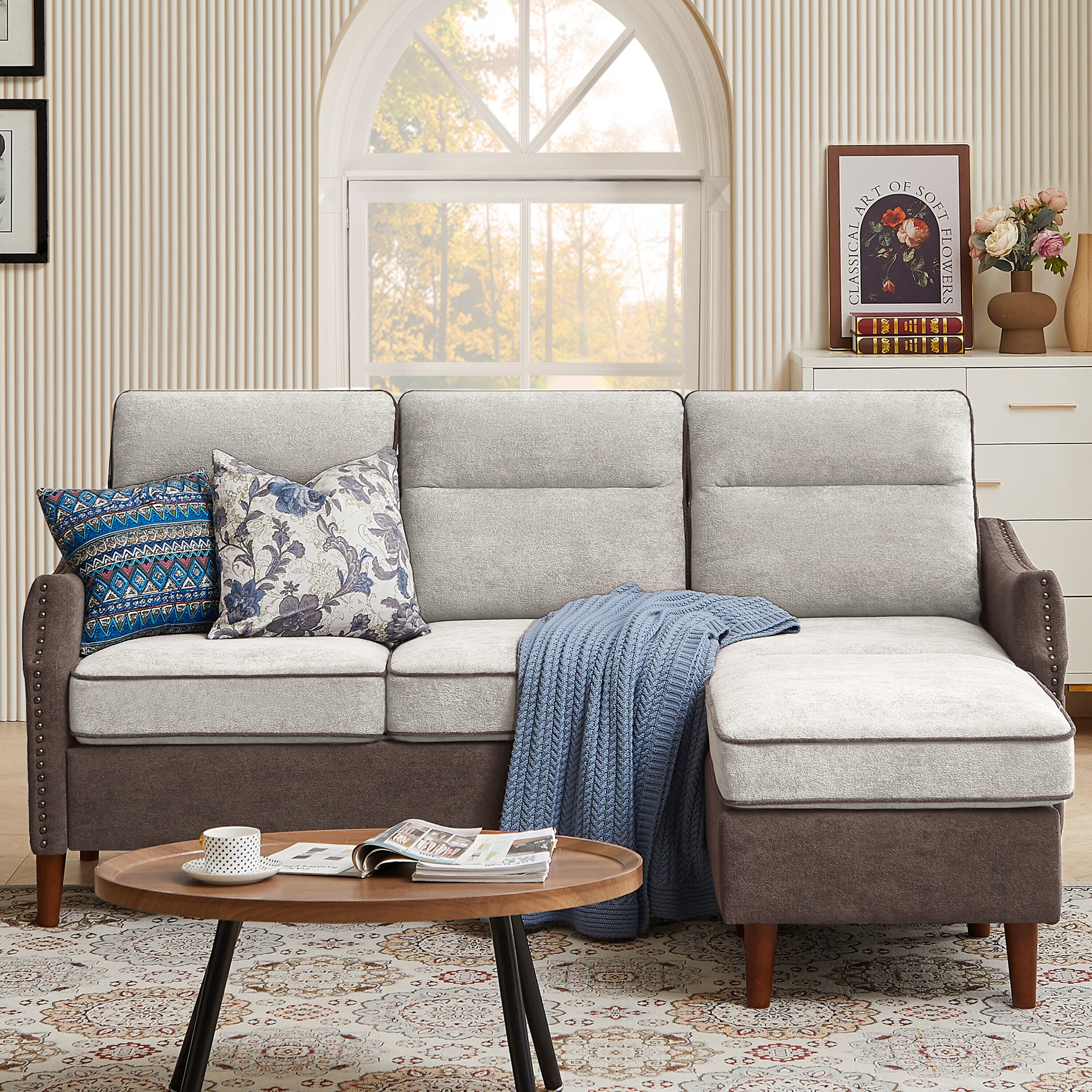 Beige 3 seater sectional couch with green and gray accent pillows