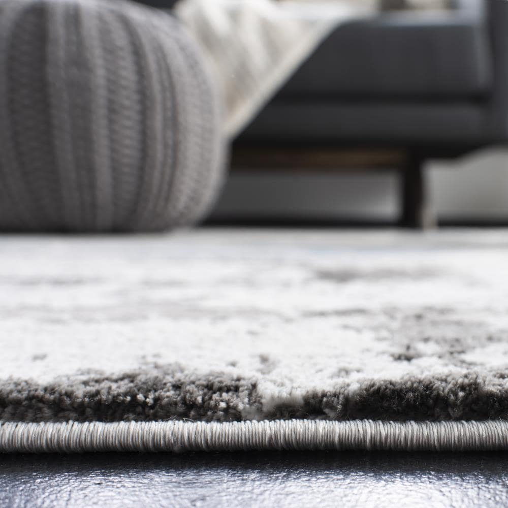 Swirling Greyscale Abstract 59" Round Synthetic Area Rug