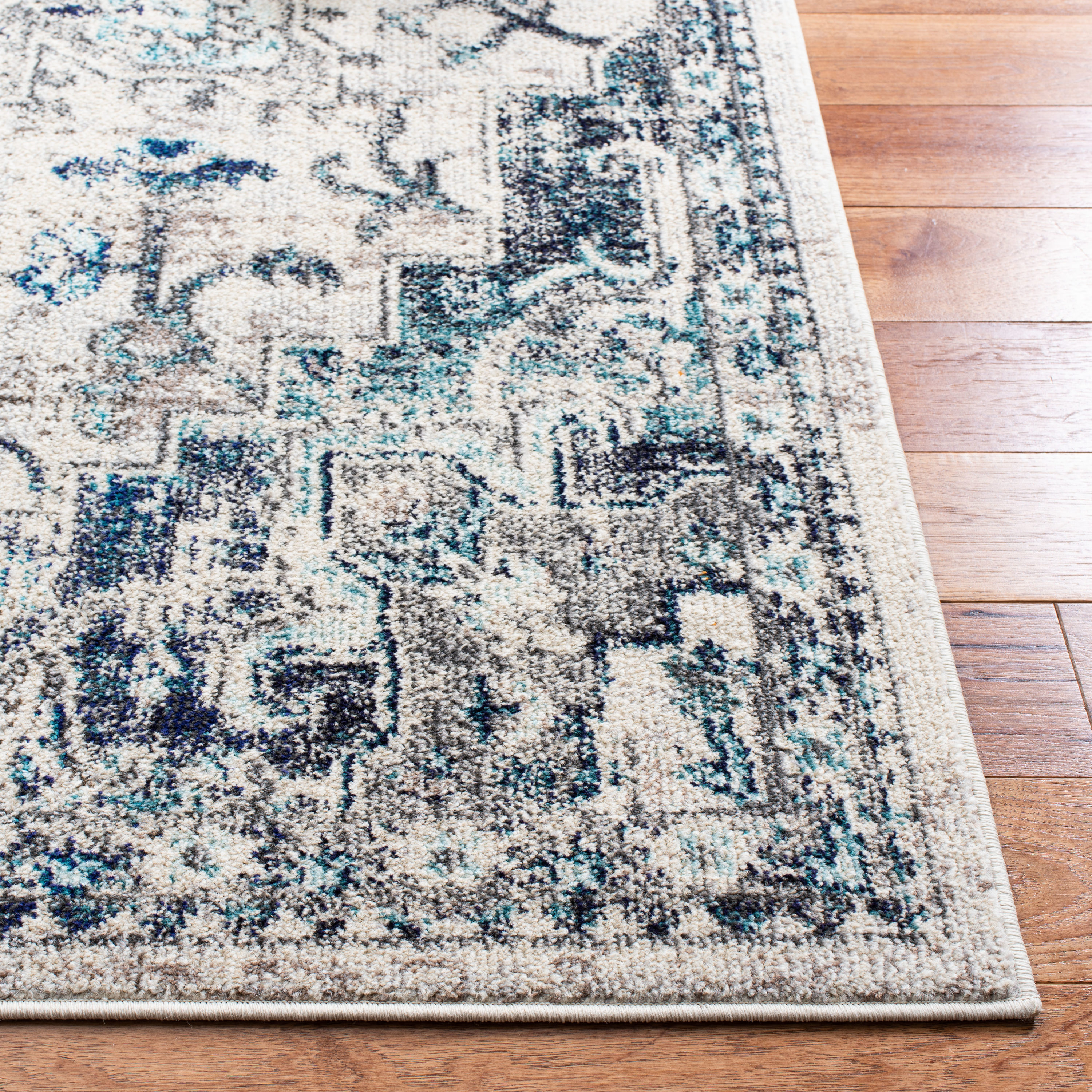 Ivory and Grey Synthetic 6' x 9' Distressed Medallion Area Rug