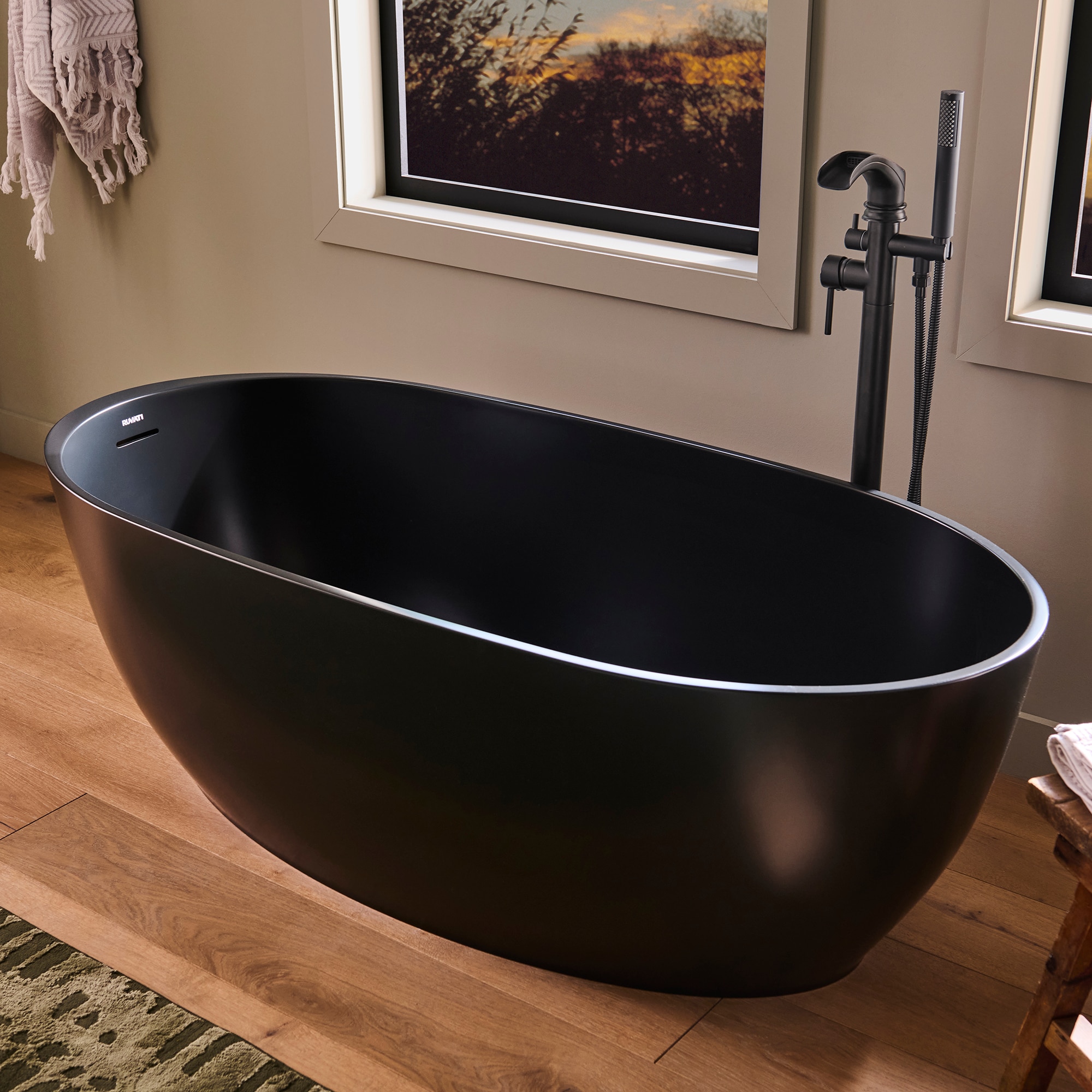 Ruvati RVB6744BK Canali 27.5-in x 59-in Black  Solid surface Oval Freestanding Soaking bathtub with Drain ( Right Drain )