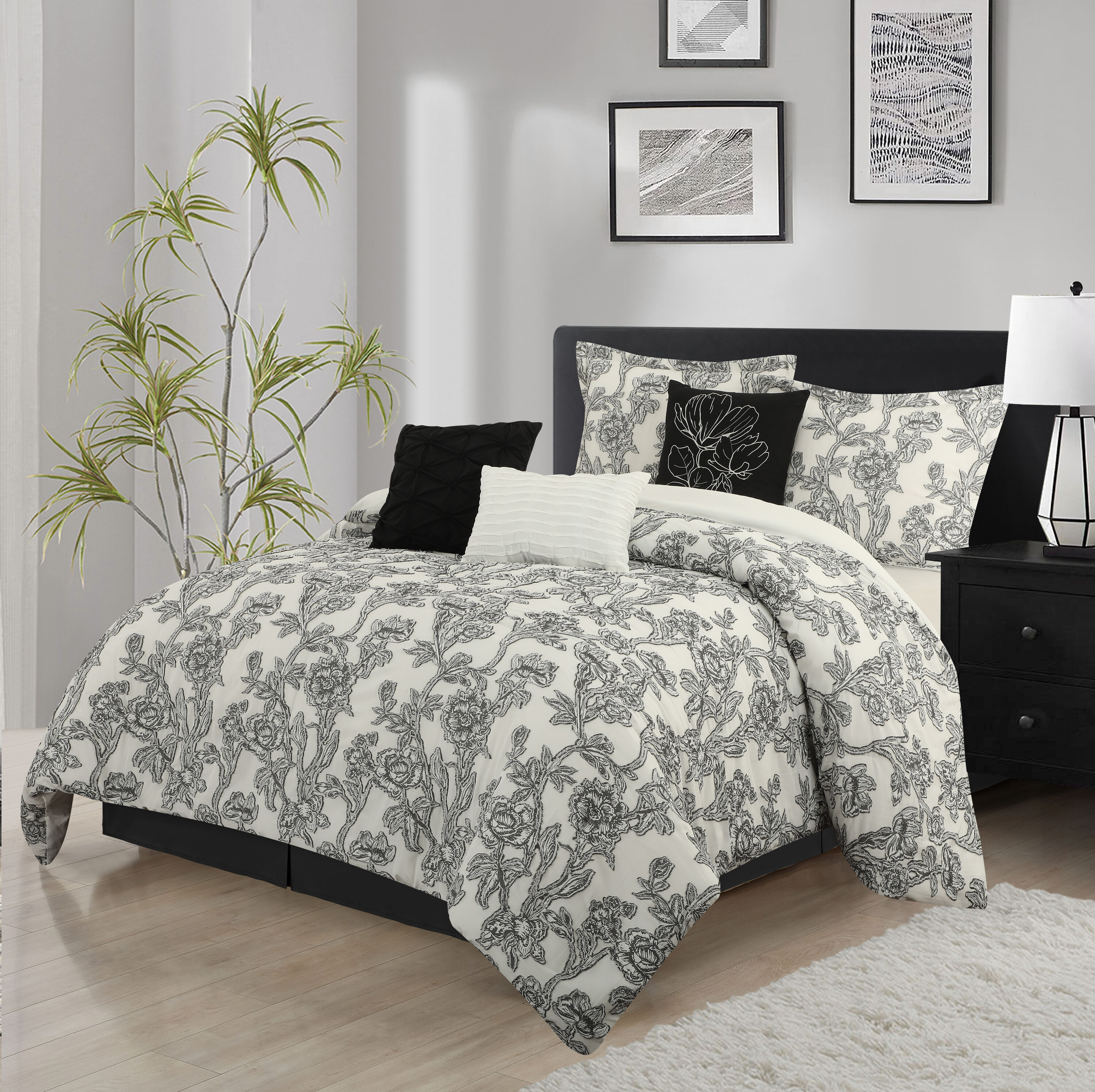 Grand Avenue Embrace timeless allure with our Floral Comforter Set. The  striking black and white palette effortlessly complements any style. Using  innovative Clip Jacquard technique, intricate floral patterns are woven  into the