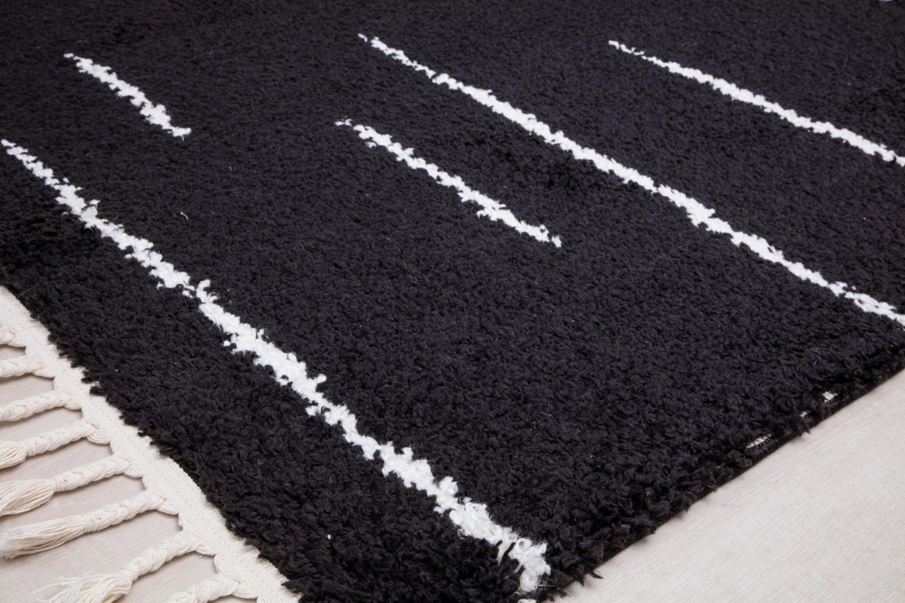 Introspective Black Abstract Shag Synthetic Area Rug with Braided Tassels