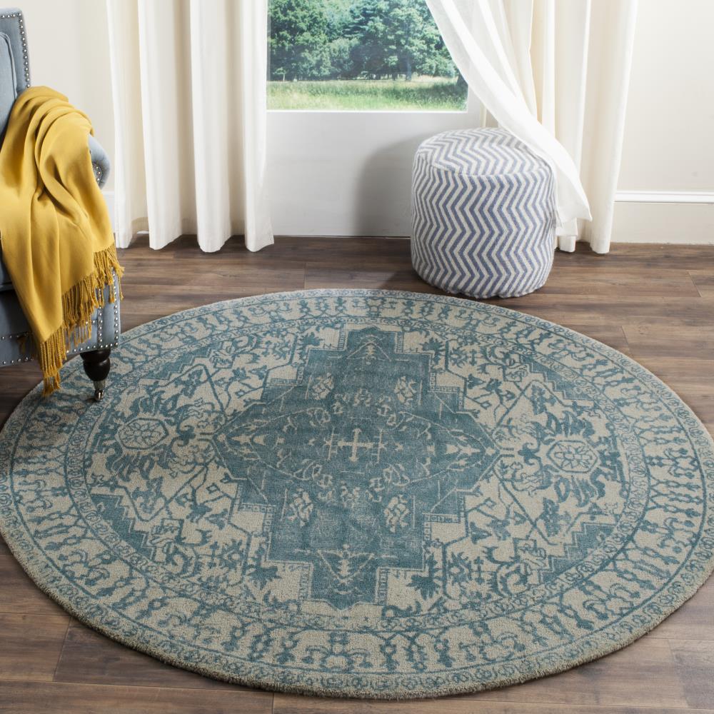Ivory and Turquoise Round Tufted Wool Area Rug