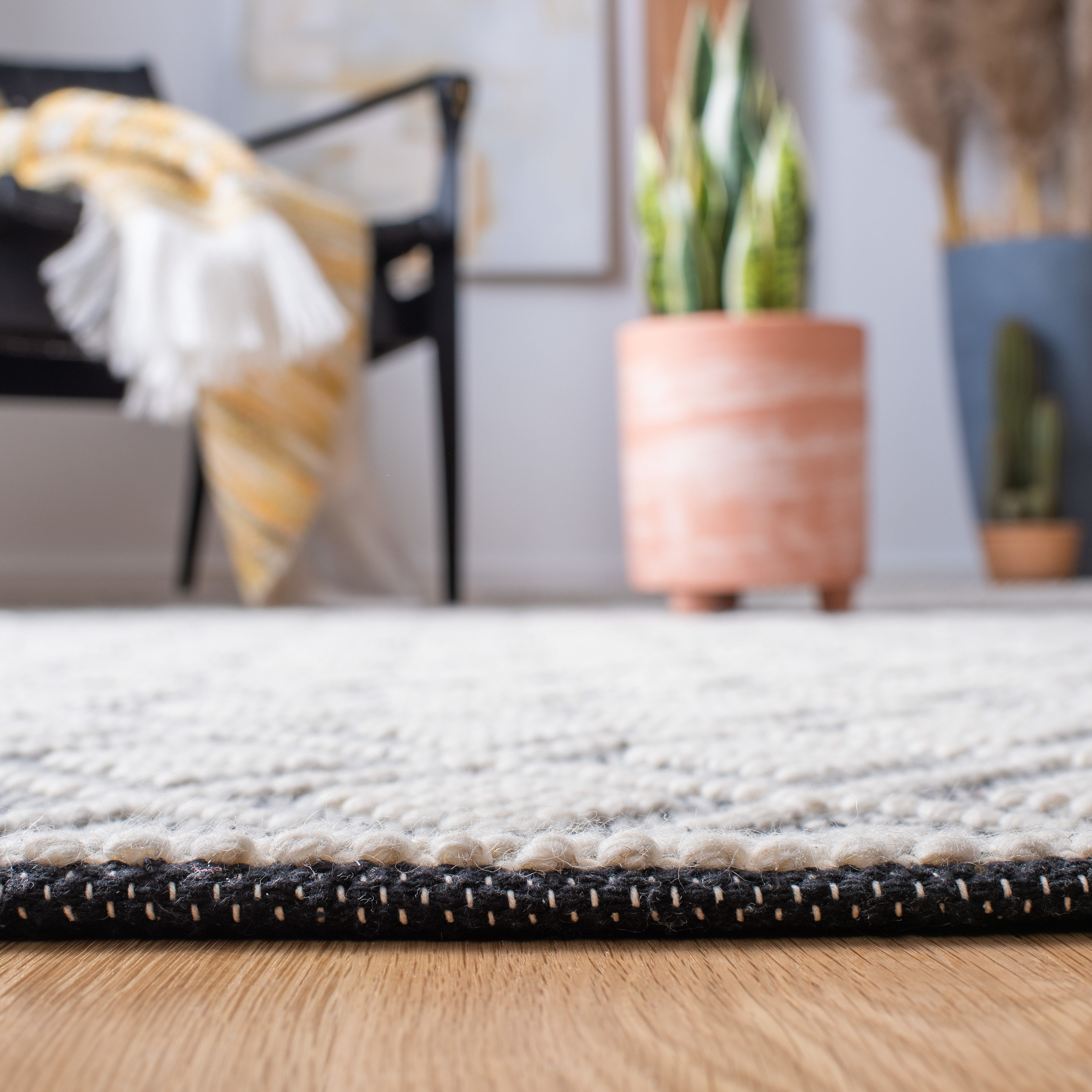 Handwoven Black and Ivory Braided Wool 6' Square Rug