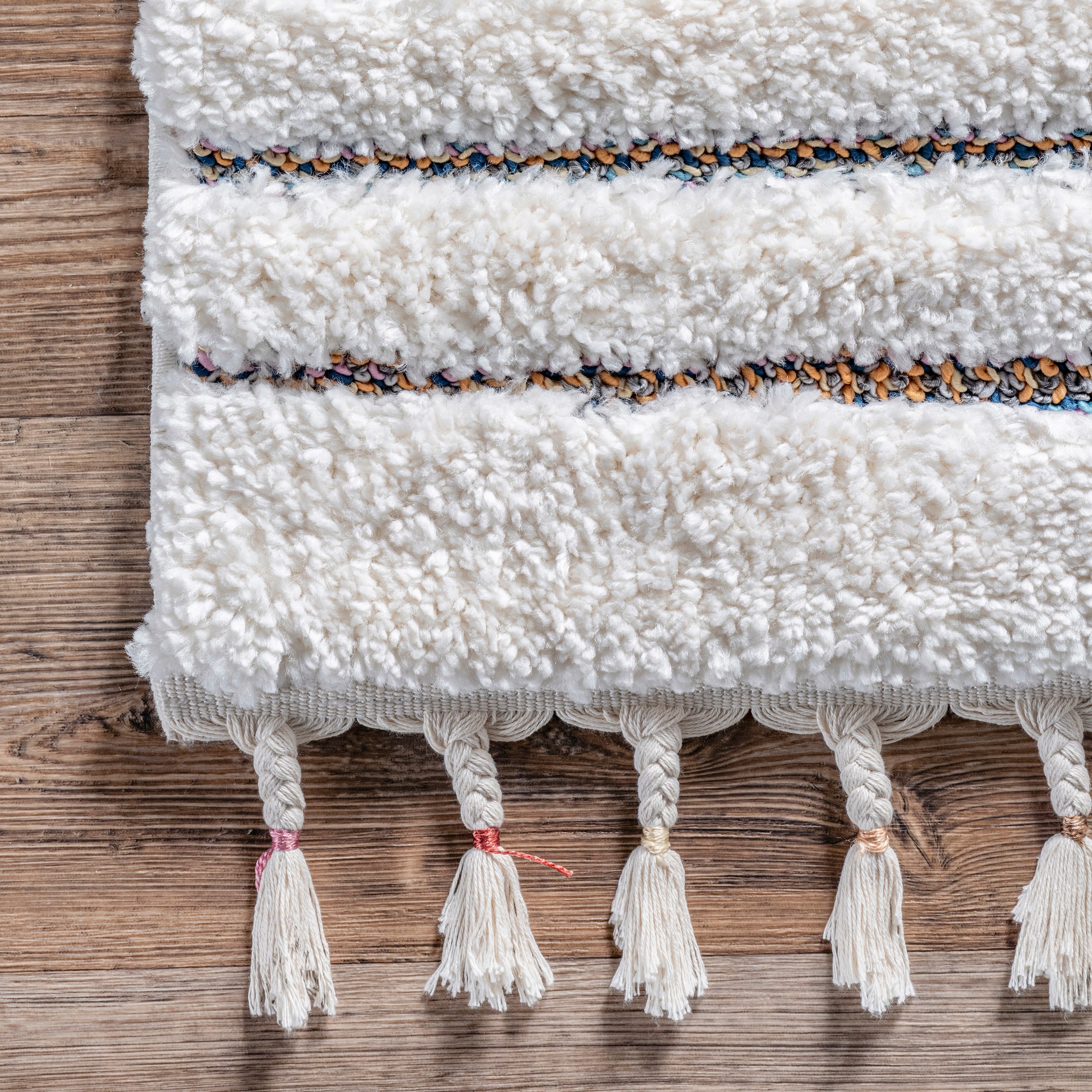 Ivory Geometric Synthetic Rectangular Area Rug with Braided Tassels