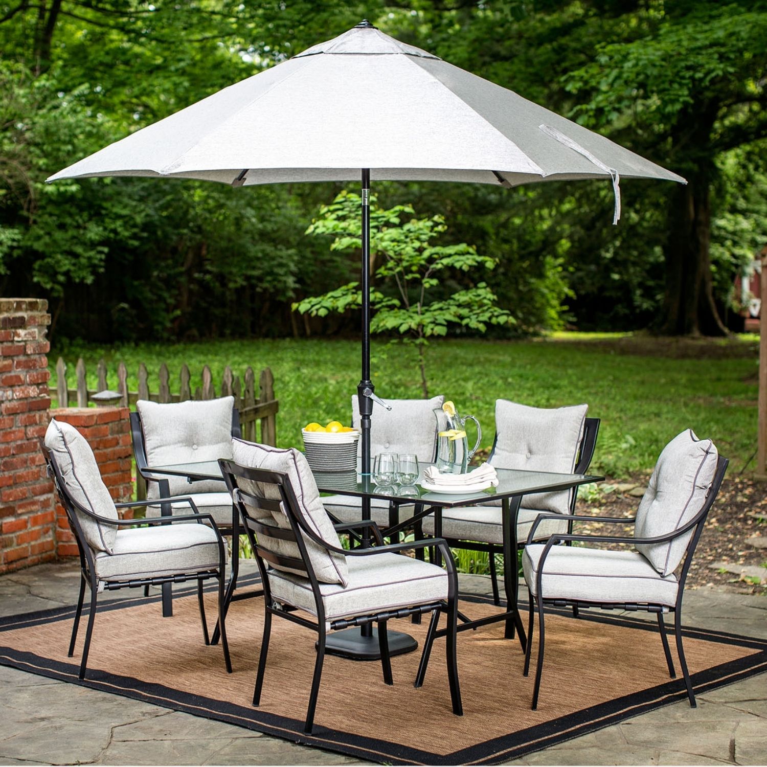 Hanover LAVDN7PC-SU 8 -Piece Black Patio Dining Set Aluminum Rectangle Table with 6 Silver Cushions Stationary Chairs and Umbrella Included