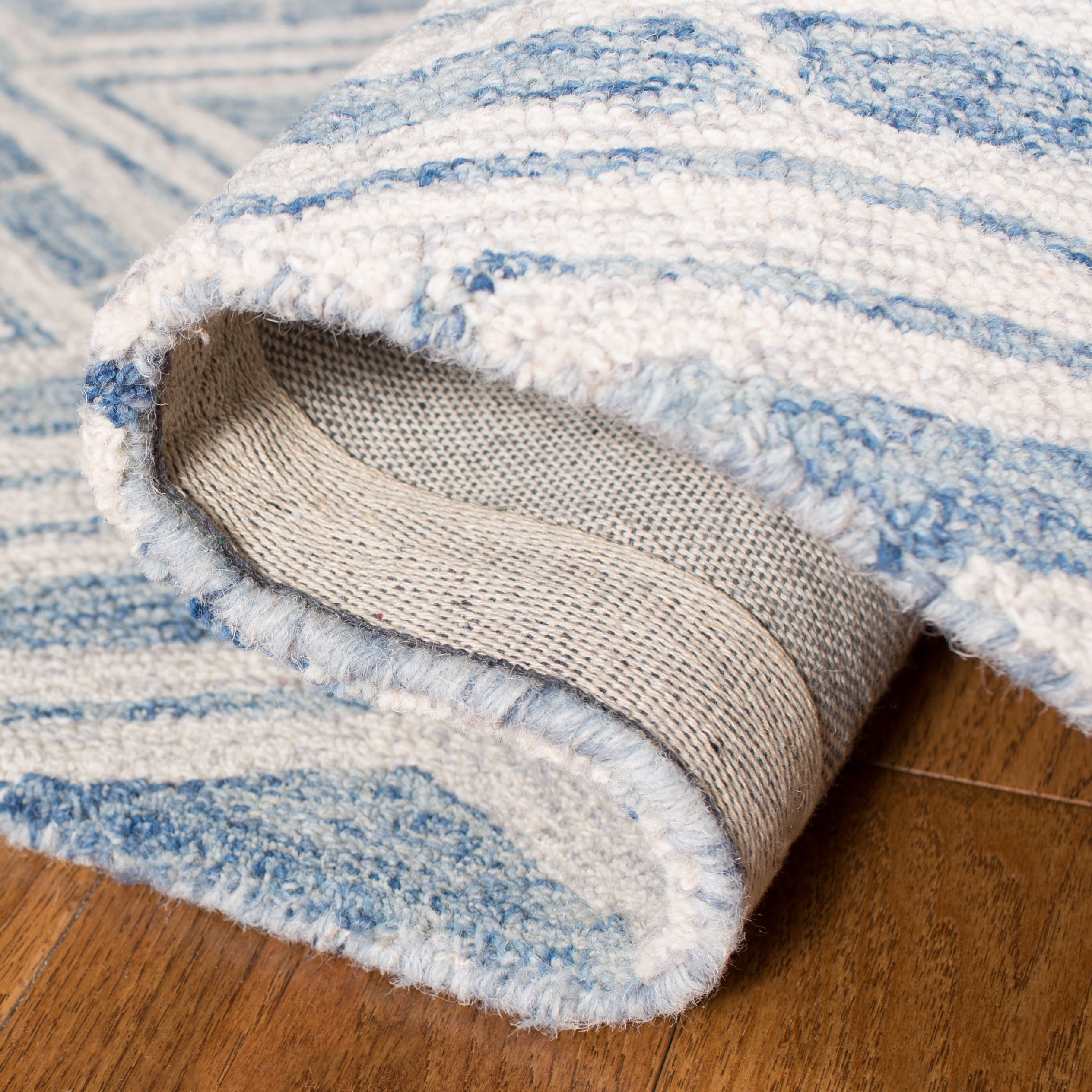 Blue and Ivory Handmade Wool Tufted Area Rug, 5' x 8'
