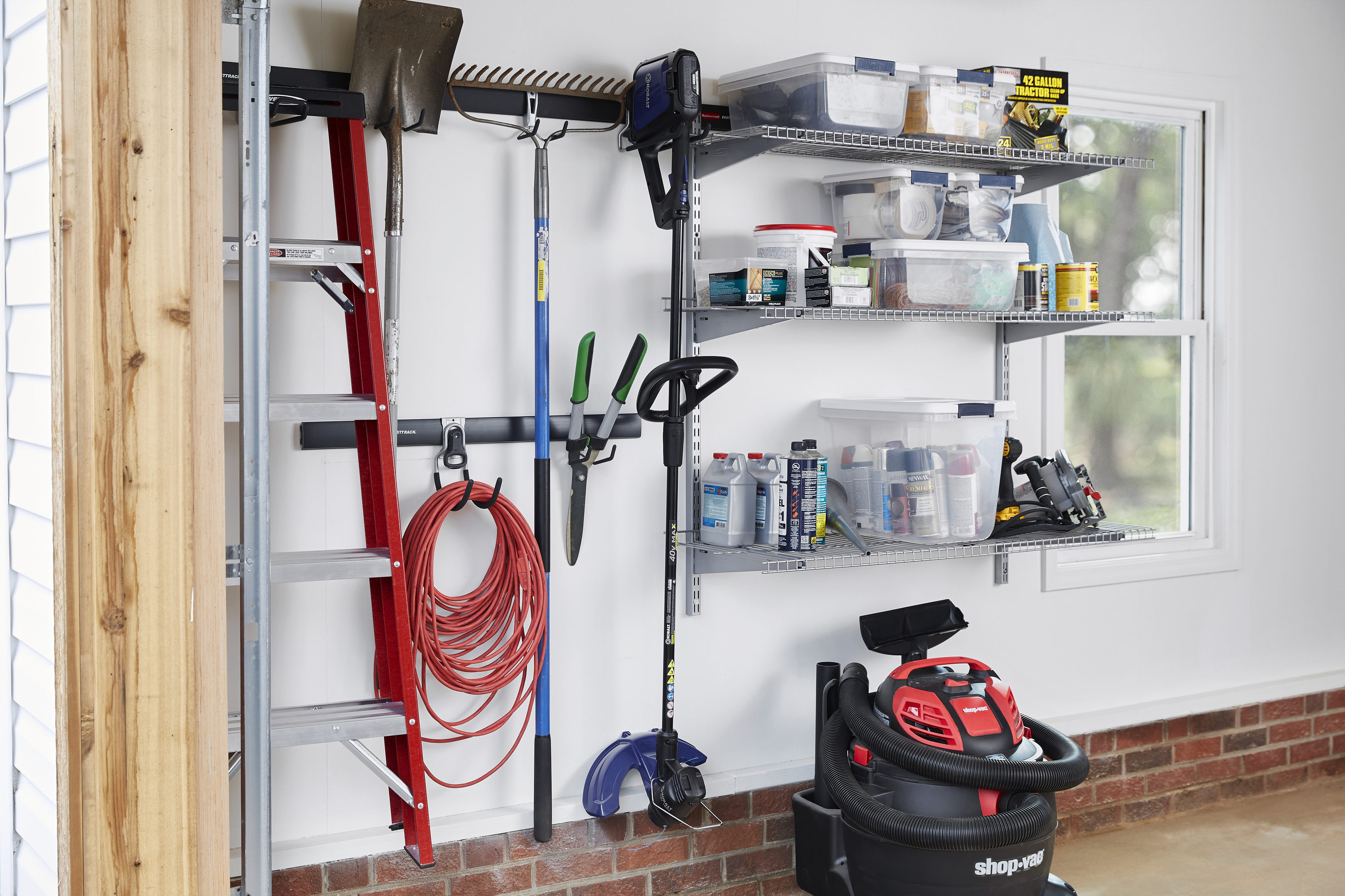 Organize your garage with the Rubbermaid FastTrack rail system at