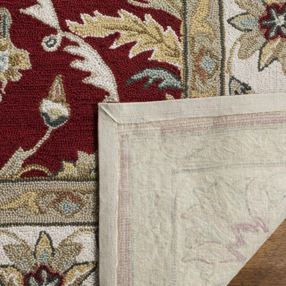 Red and Ivory Hand-Hooked Synthetic 6' x 9' Area Rug