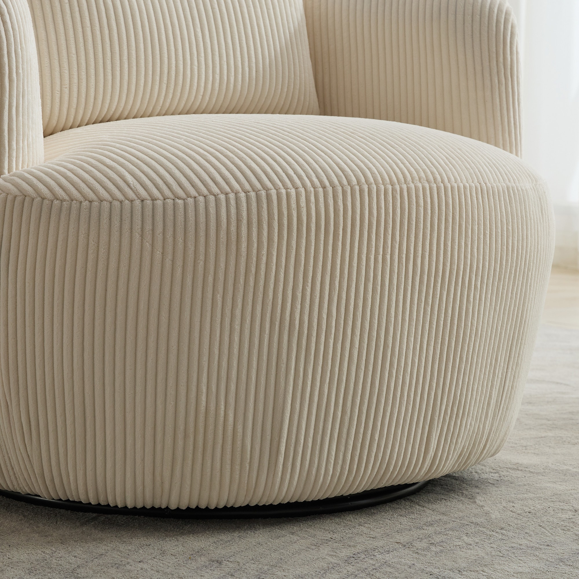 Side view of the ivory corduroy swivel accent chair with ribbed texture