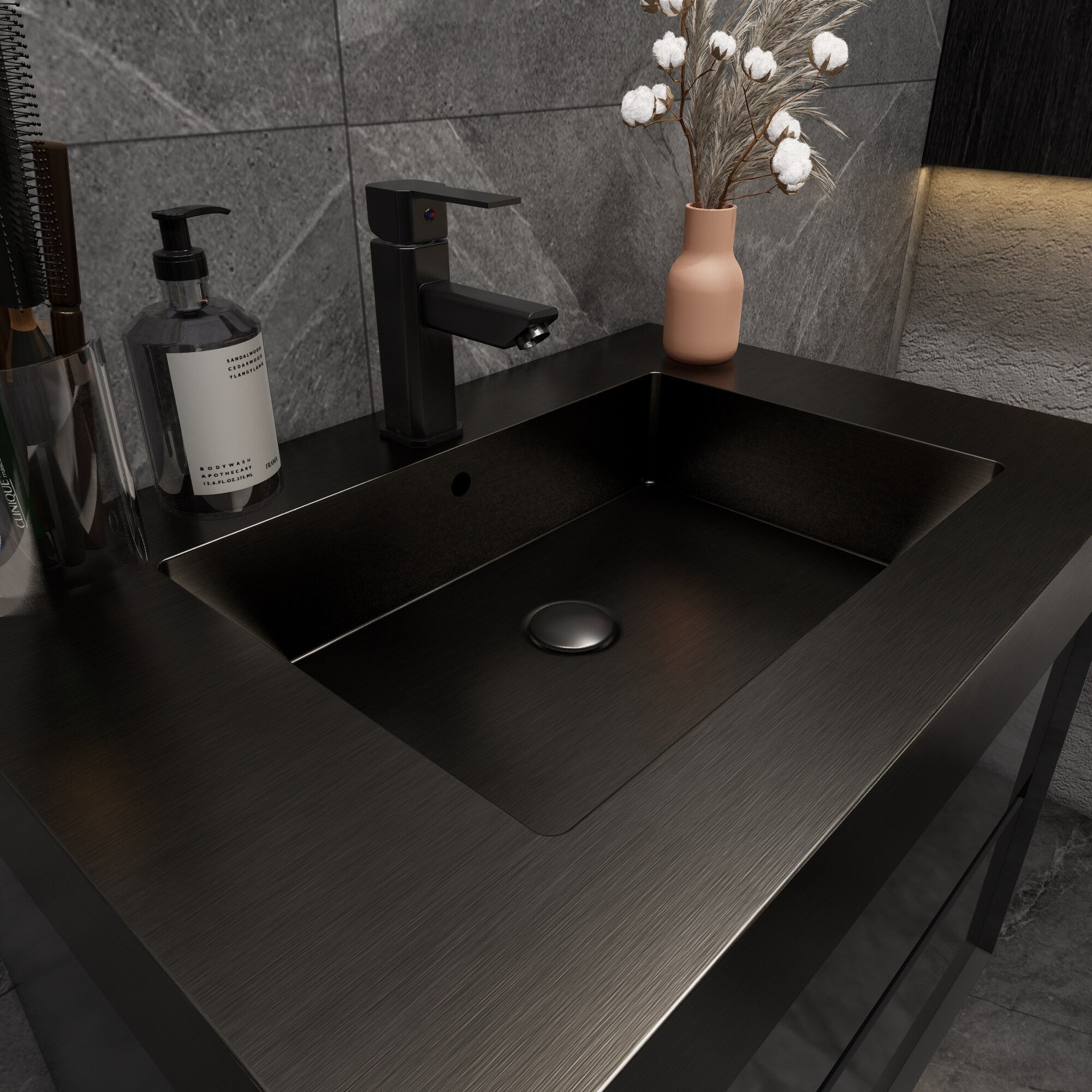 Close-up of black sink integrated into dark vanity