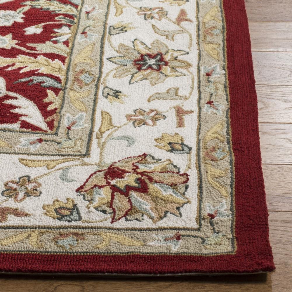 Red and Ivory Hand-Hooked Synthetic 6' x 9' Area Rug