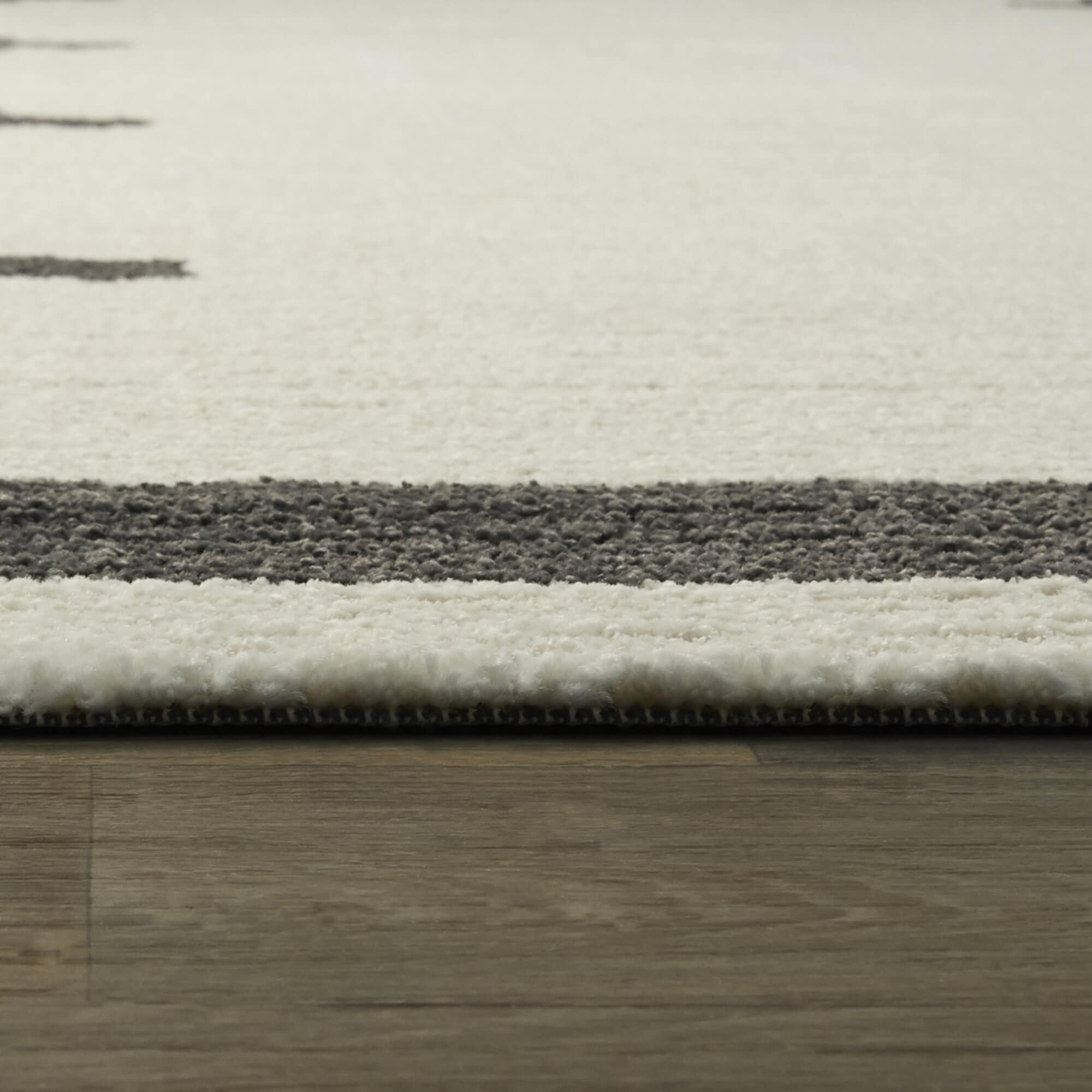 Brynja Off-White and Black Geometric Synthetic Area Rug