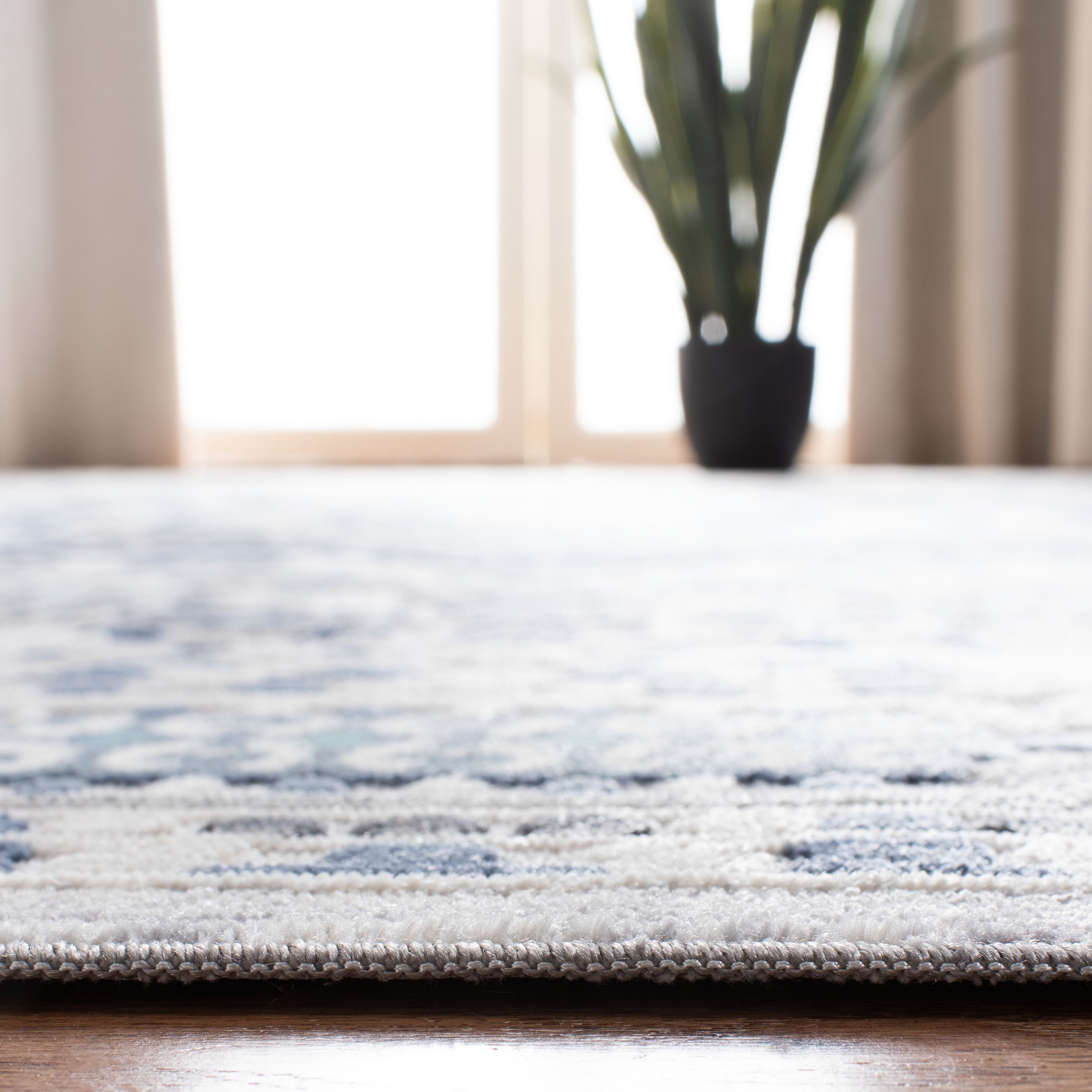 Elegant Gray and Cream Floral 4' x 6' Synthetic Wool Area Rug
