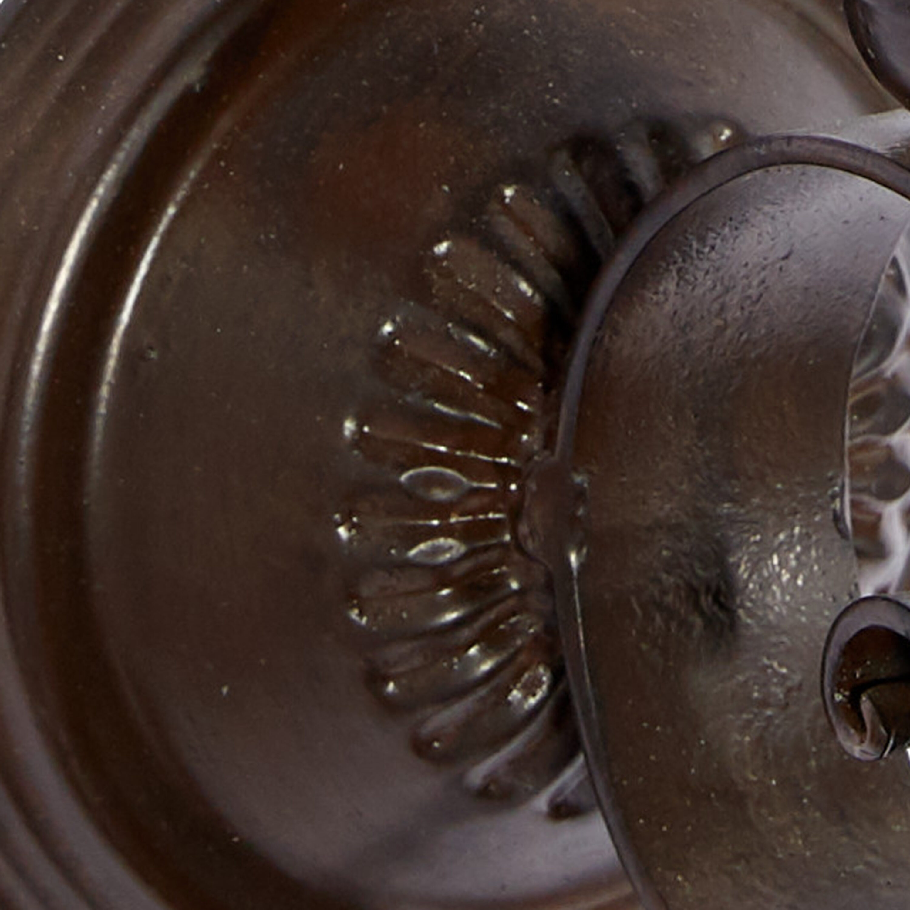 Brown Metal Scroll Wall Sconce with Glass Hurricane