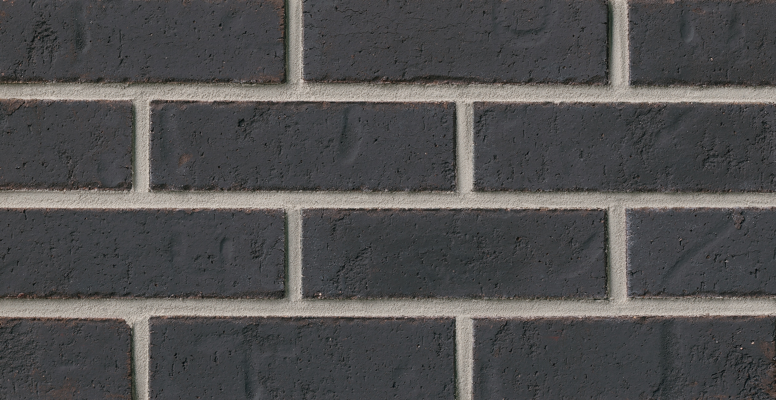 General Shale 6066050000 Thin Brick Triton Black 2-in x 8-in Tumbled Ledgestone Border Tile ( 7.3-Sq. Feet / Carton ) 50 -Pack