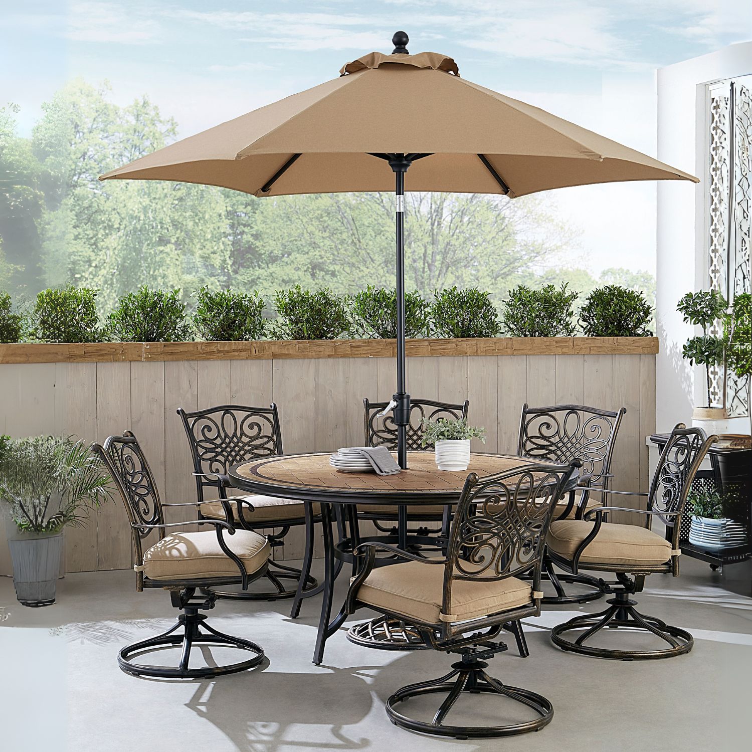 Hanover MONDN7PCSW6RDTLCSUT 7-Piece Brown Wicker Patio Dining Set Aluminum Round Table with 6 Tan Cushions Swivel Rocker Chairs