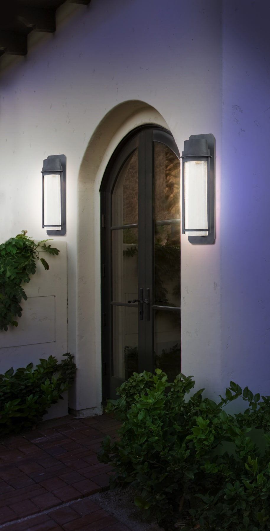 Black Bronze Cylinder Outdoor Wall Sconce with Seeded Glass
