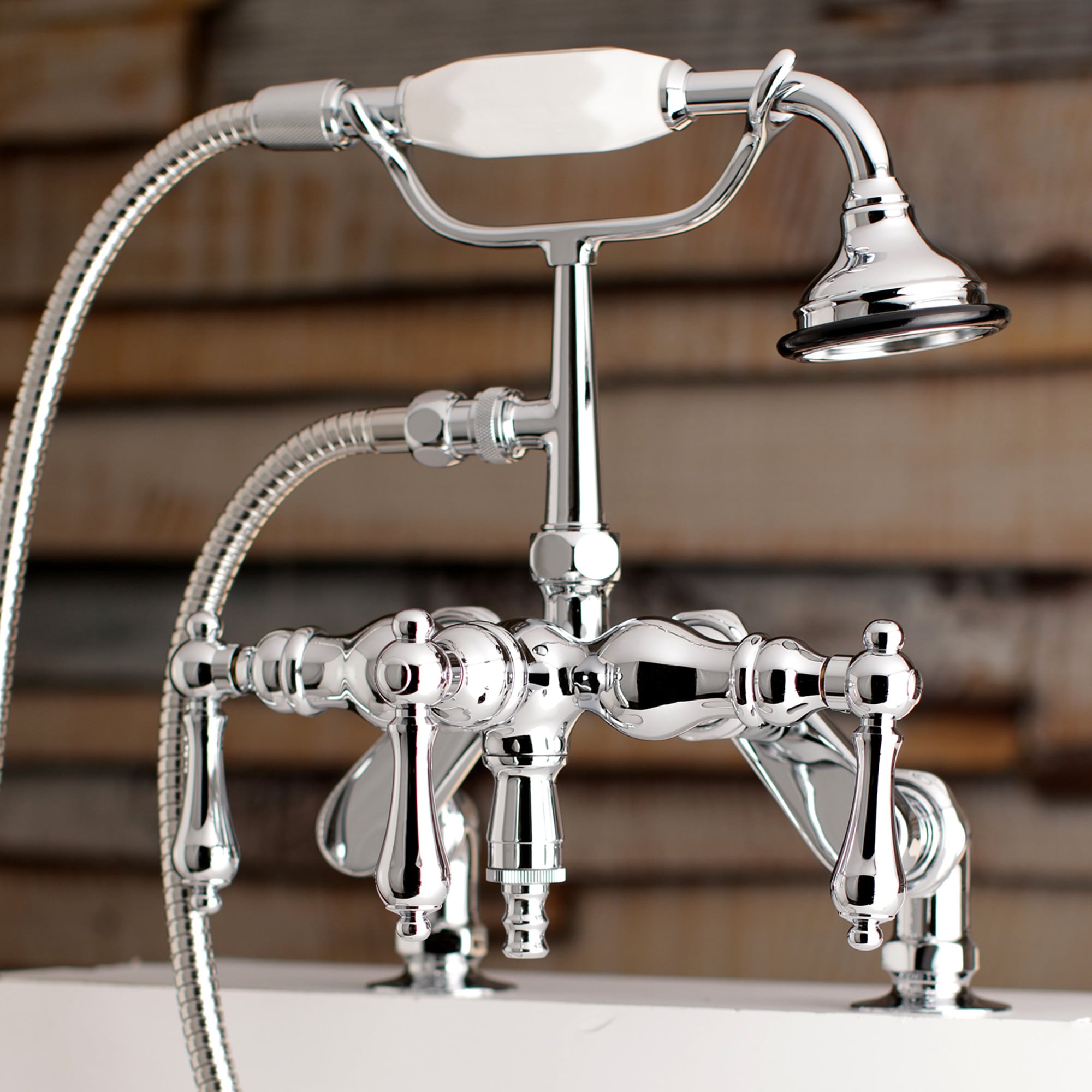 Kingston Brass WLAE620T1 Vintage Polished chrome 3-handle Deck-mount Roman Low-arc Bathtub Faucet with Hand Shower ( Valve Included )