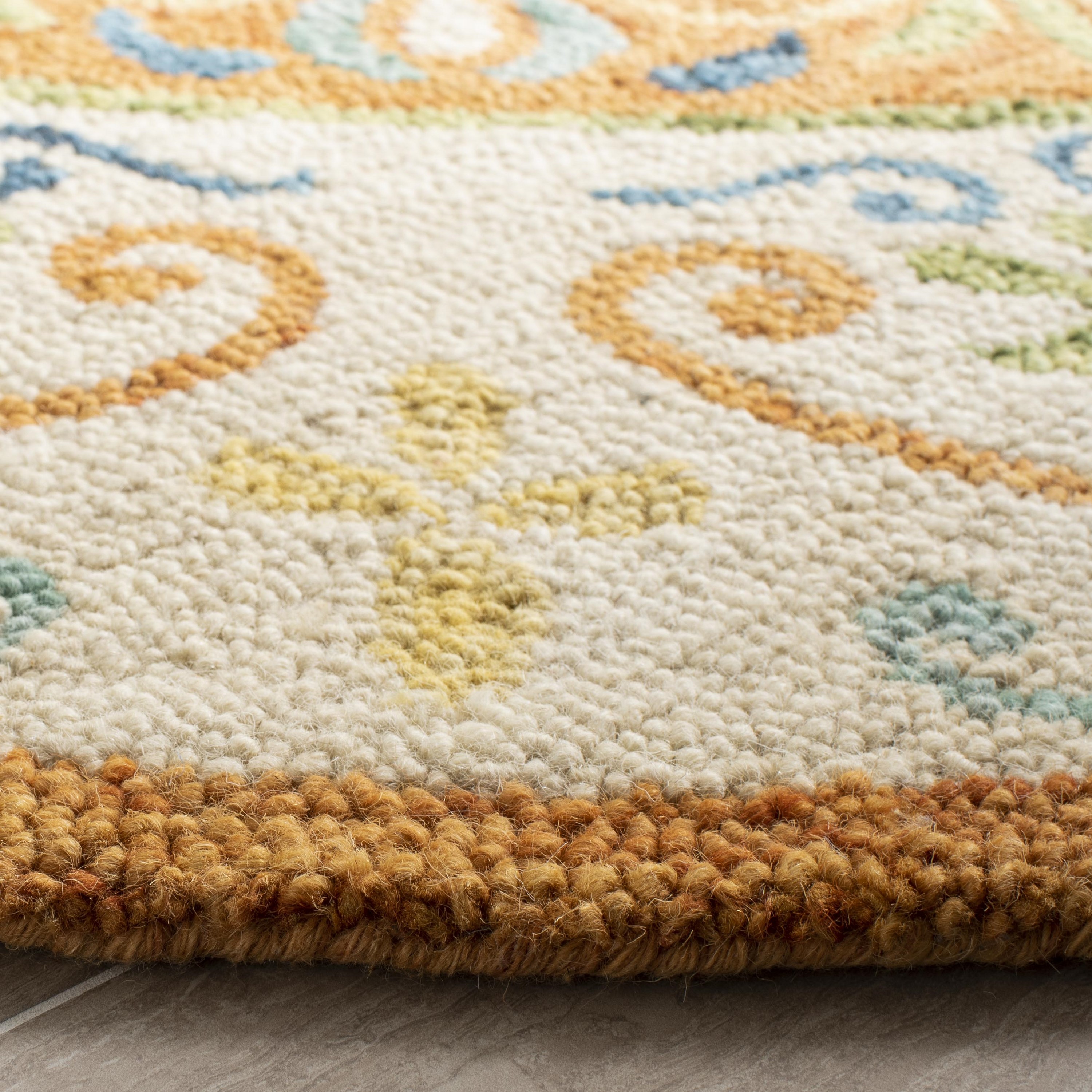 Handmade Round Rust and Ivory Wool Tufted Rug