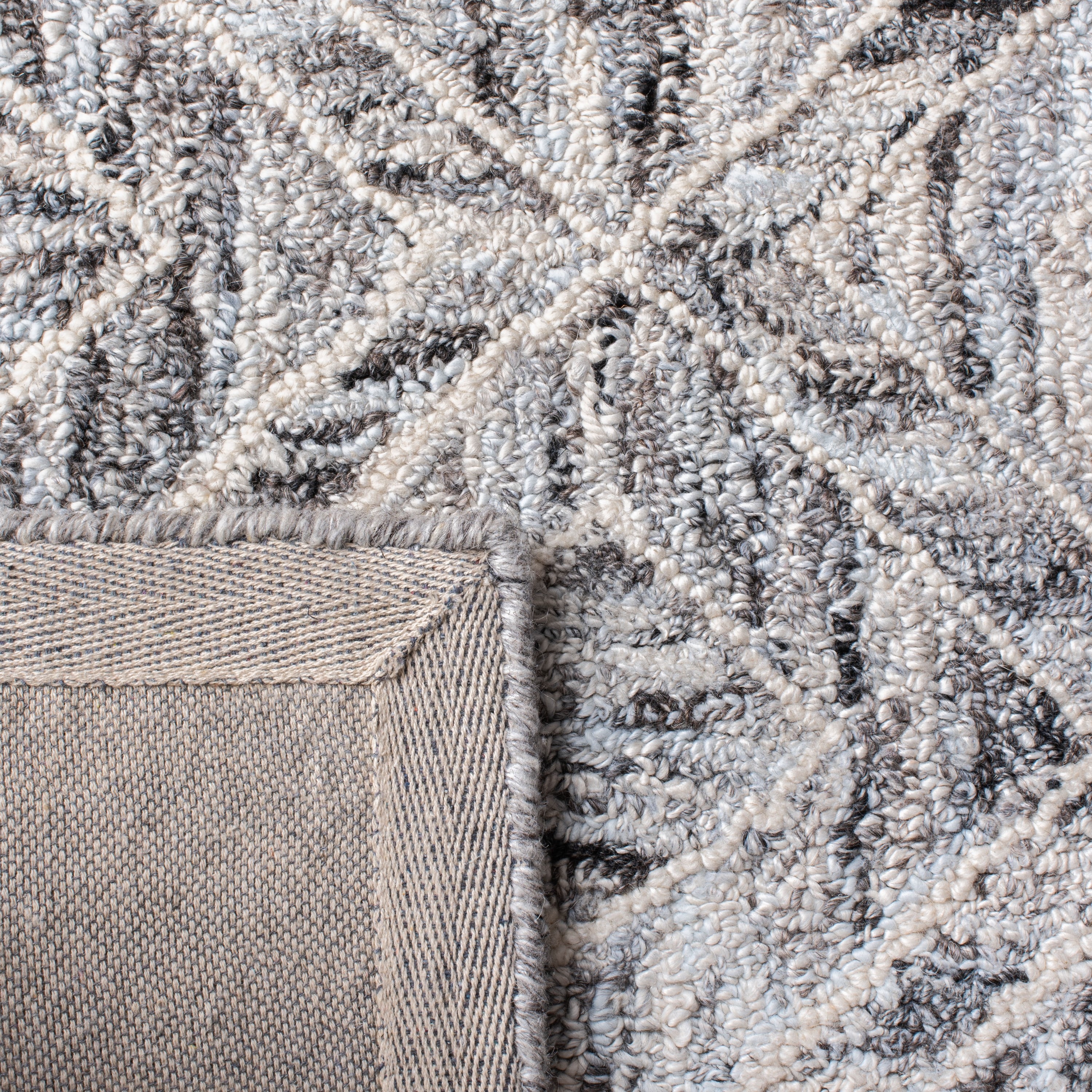 Handmade Abstract Gray and Beige Tufted Wool Rug - 27" x 7"