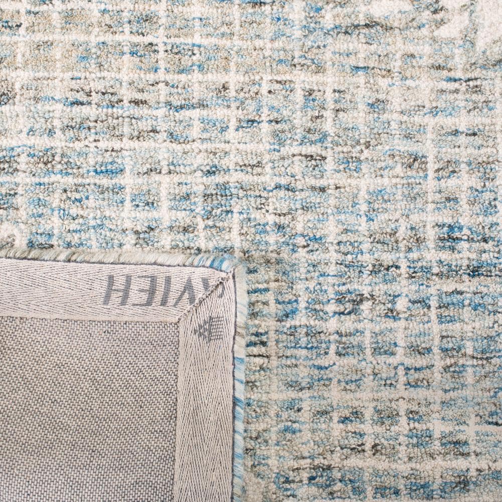 Handmade Abstract Round Tufted Light Blue Wool Blend Area Rug, 4' x 6'